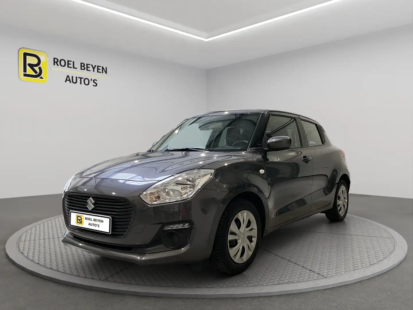 Suzuki Swift 1,2 HYBRID AC 1 Eig 10,620 EX. BTW 12M OMNIUMGAR Gris - 1