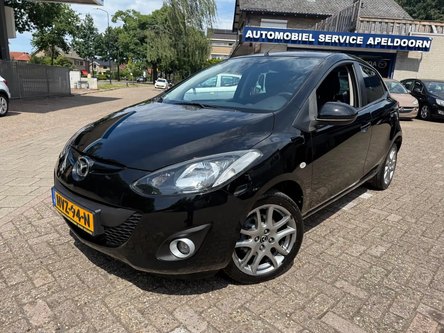 Mazda 2 1.3 TS Plus *CLIMA*STOELVERW.*PDC*ELEKTR. PAKKET*L Schwarz - 1