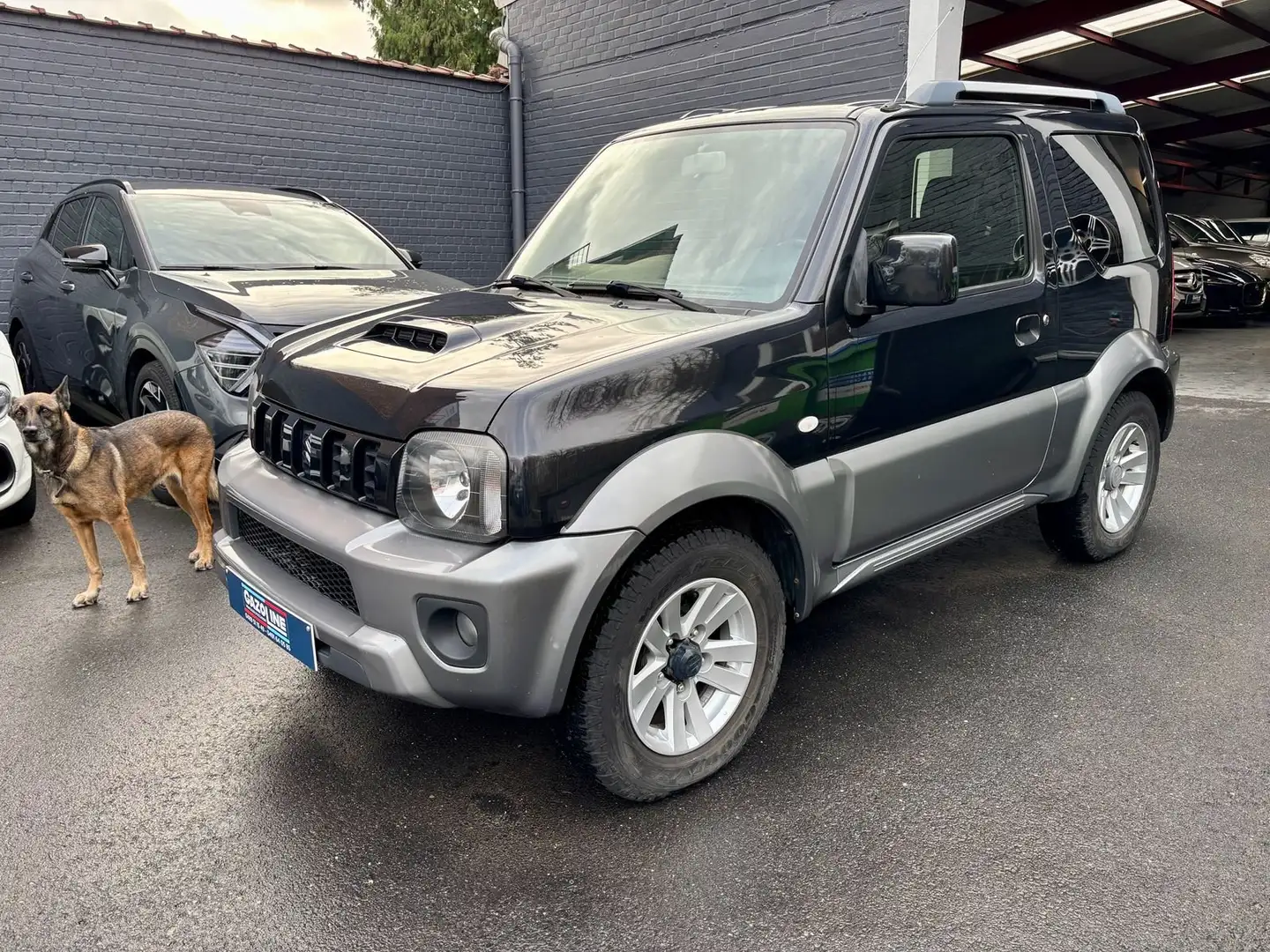 Suzuki Jimny Jimny 1.3i JLX Dakota/ Automatique Schwarz - 1