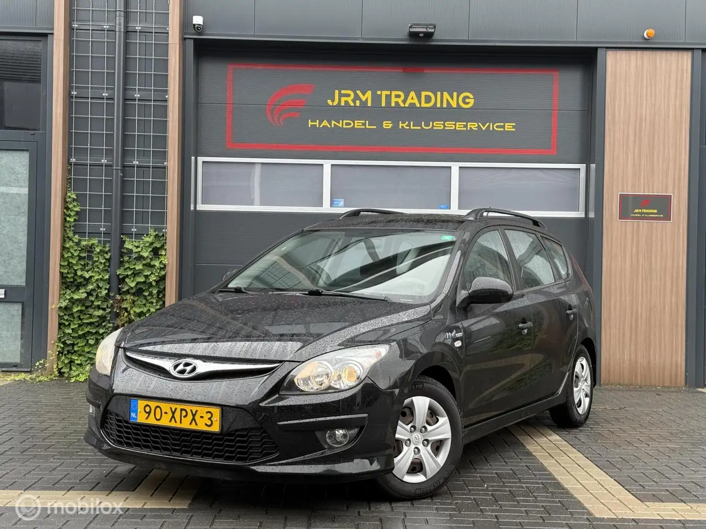 Hyundai i30 CW 1.4i i-Motion Airco NAP! Zwart - 1