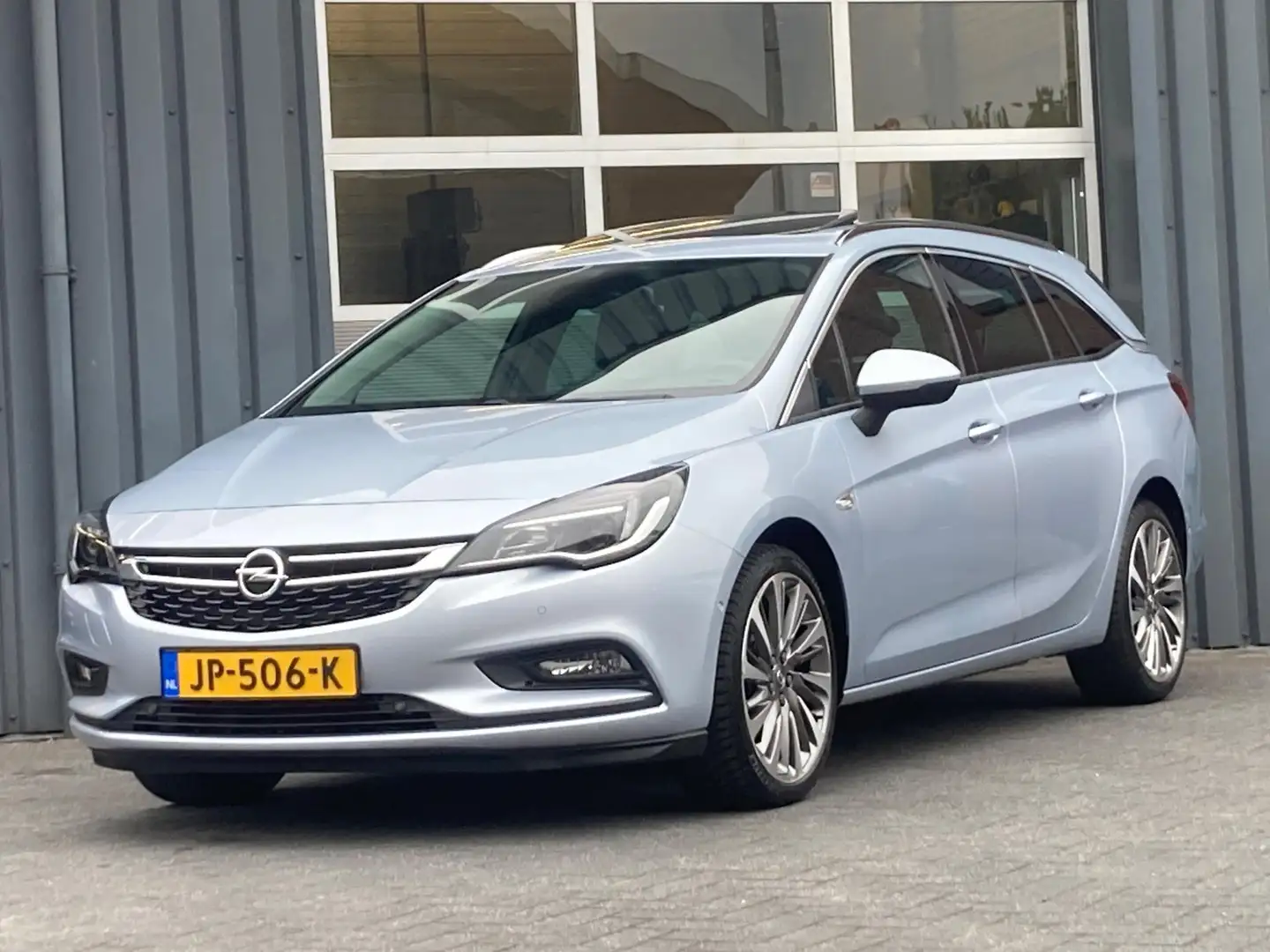 Opel Astra Sports Tourer 1.4 Innovation Automaat Navi Cruise Grijs - 1