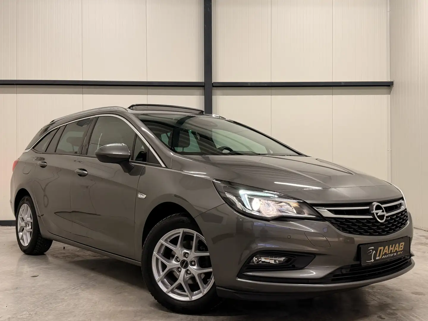 Opel Astra Sports Tourer 1.4 Turbo | Schuif/Kantel Dak | Matr Grijs - 1