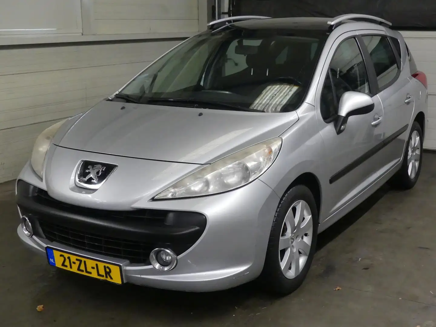 Peugeot 207 SW 1.6 VTi XS - Mooie auto - APK 2026 - Airco Grijs - 1