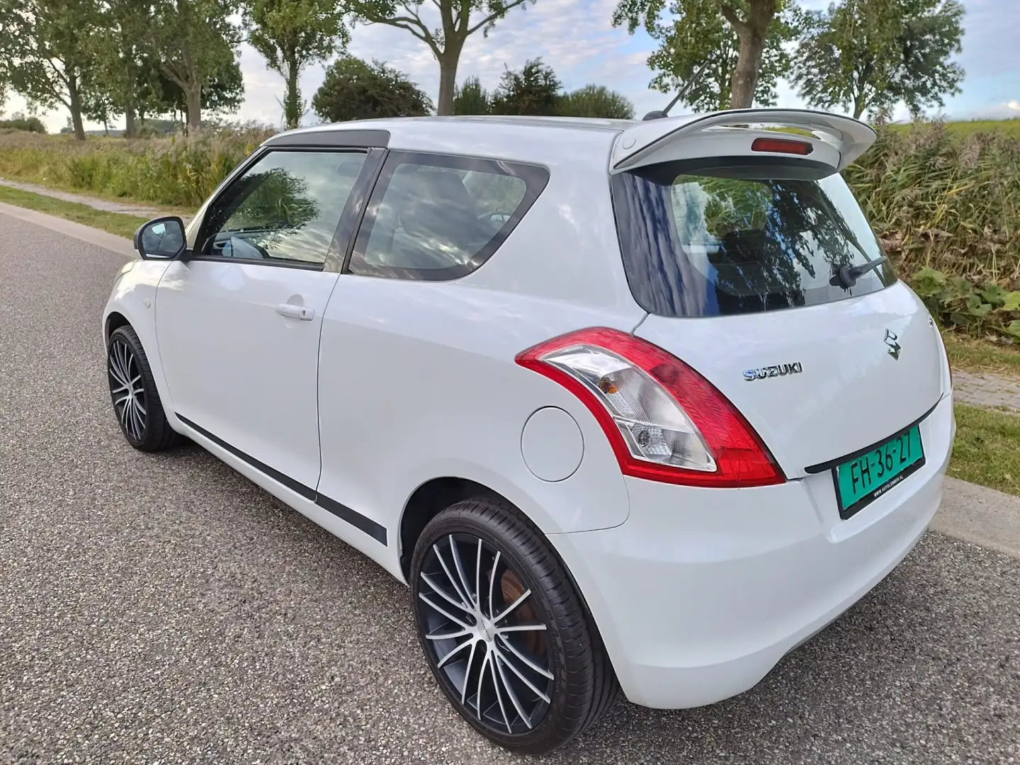 Suzuki Swift 1.2 ** 92 PK ** Airco **Lm velgen ** 128.605 km Wit - 2