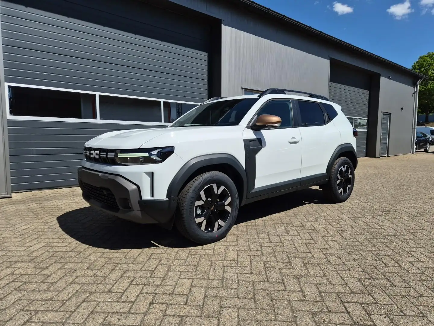 Dacia Duster Extreme Hybrid 140PS Automatik 1.6 SCE Lenkradh... Weiß - 1
