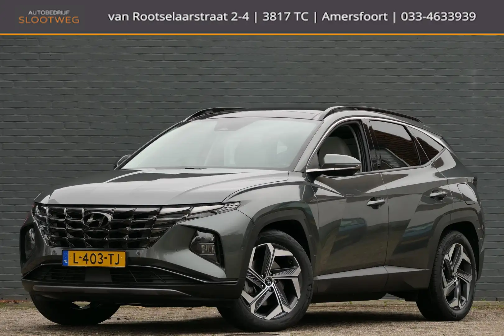 Hyundai TUCSON 1.6 T-GDI PHEV Premium Sky 4WD | Leer | Keyless | Grijs - 1