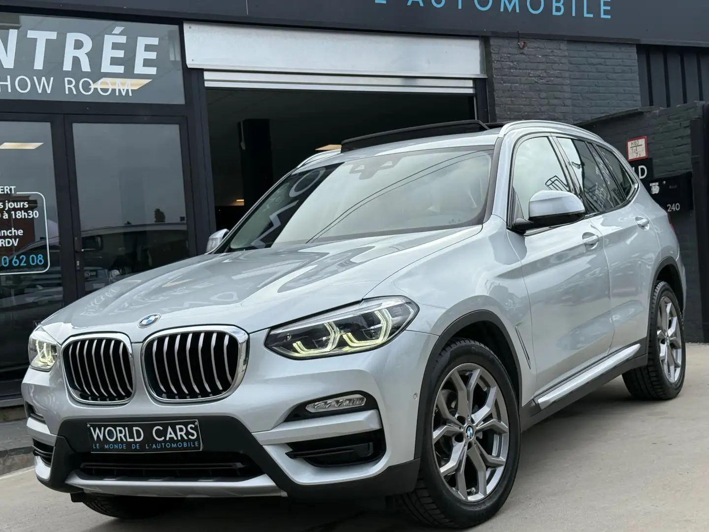 BMW X3 2.0dA xDrive20 TOIT PANO - CAMERA - AUTO - FULL OP Silber - 1