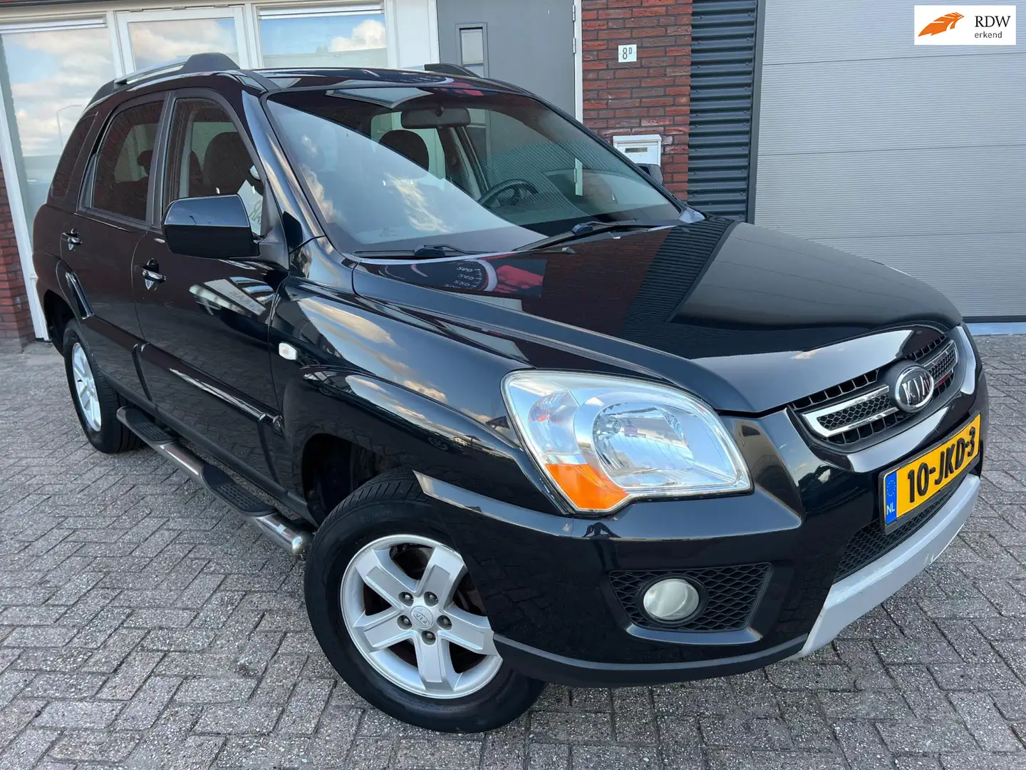 Kia Sportage 2.0 CVVT X-tra / PDC / Airco / Cruise / NAP / LM Negro - 1