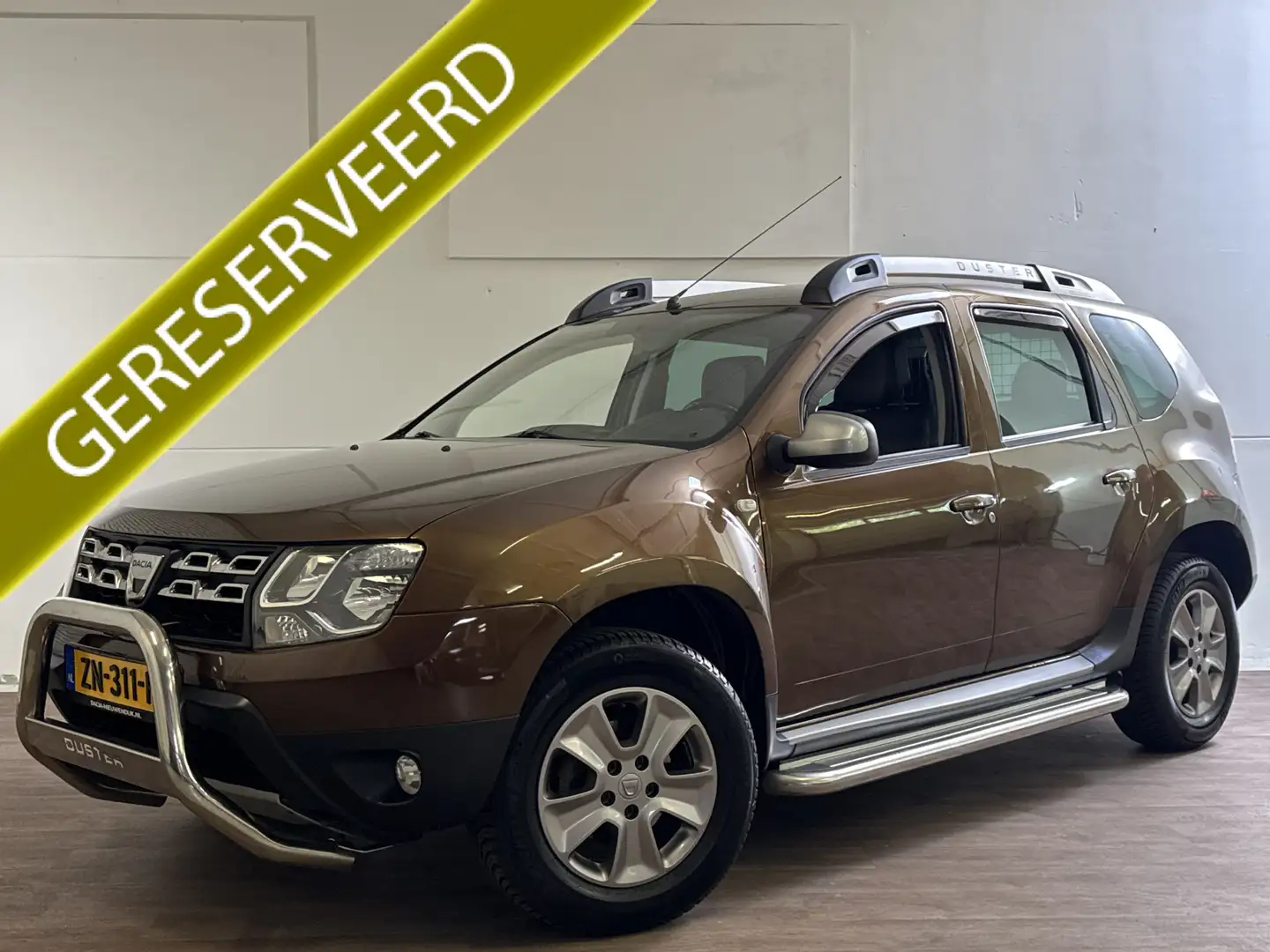 Dacia Duster 1.2 TCe 4x2 PRESTIGE LEDER/NAVI/TREKHAAK Bruin - 1