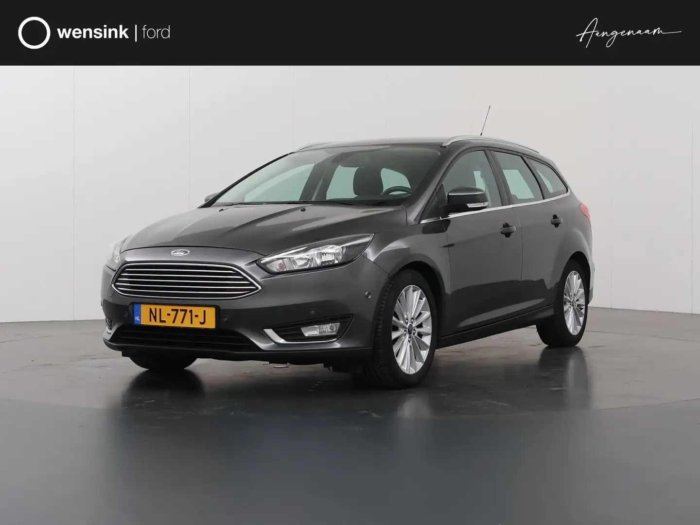 Ford Focus Wagon 1.0 Titanium | Trekhaak | Navigatie | Climat Gris - 1