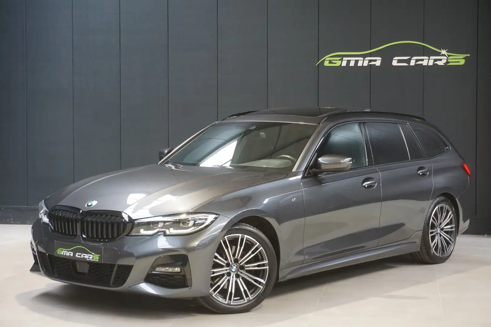BMW 320 iA Touring M Pack-Nav-Pano-H.Leder-PDC-Garantie Grijs - 1