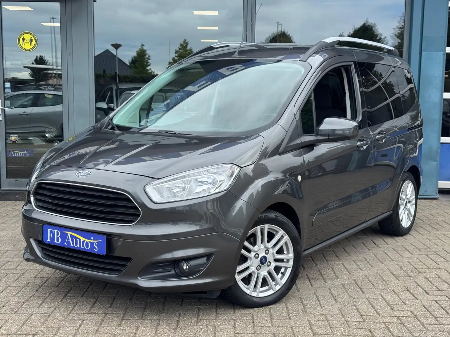 Ford Tourneo Courier 1.0 Titanium Airco Lmv Grijs - 1