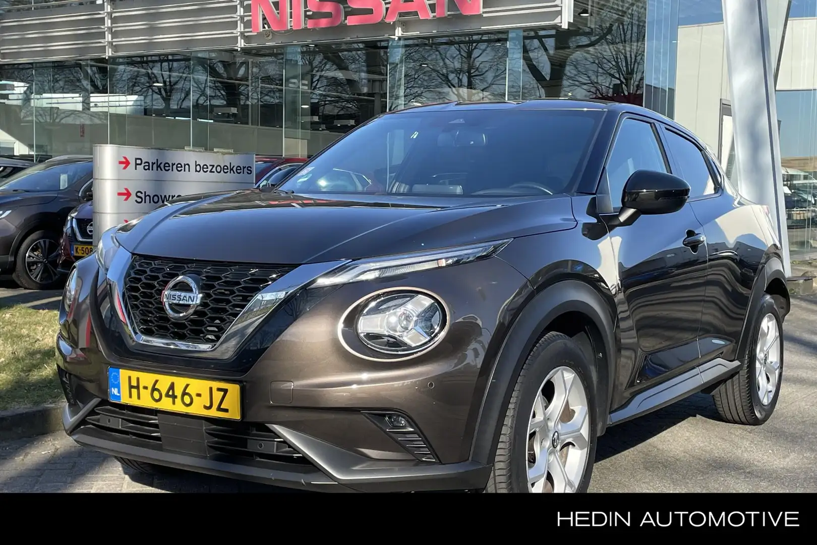 Nissan Juke 1.0 DIG-T N-Connecta 1e eig., Nav, Cruise, Airco, Bruin - 1