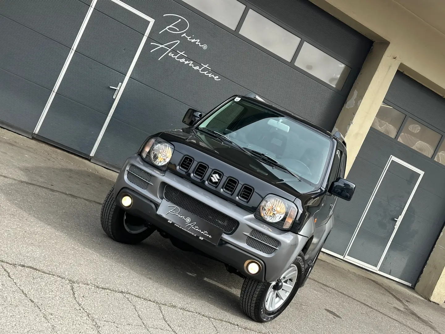 Suzuki Jimny 1,3 VX 4WD Deluxe Allrad* NAVI* Leder* AHK* Schwarz - 1