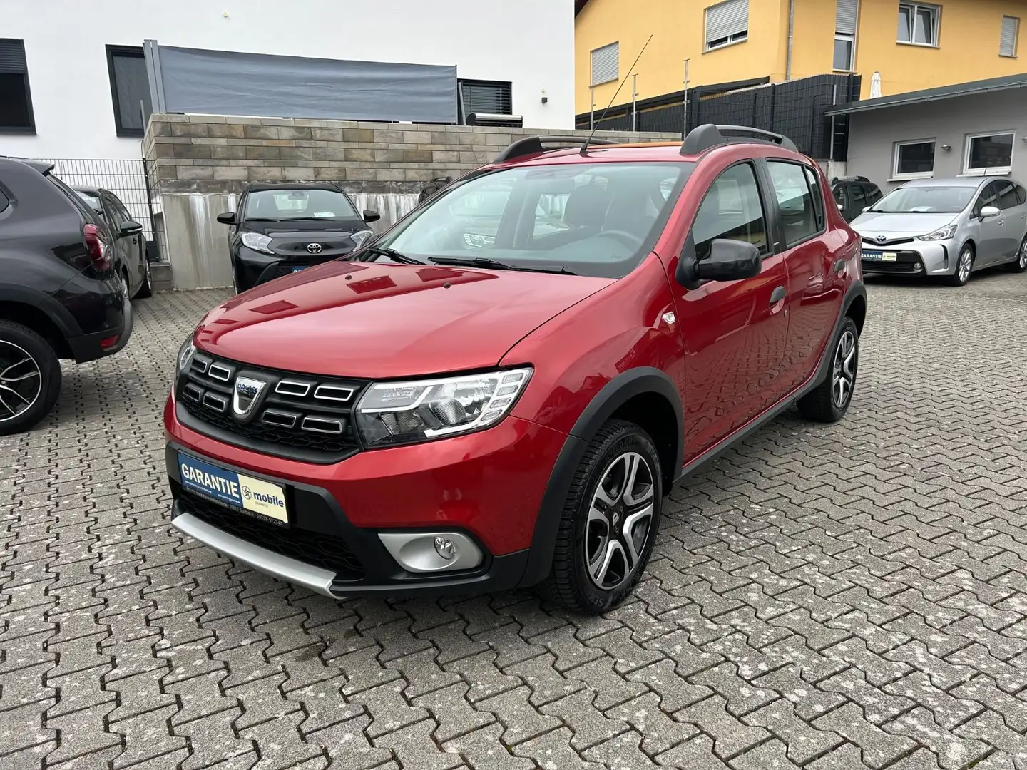 Dacia Sandero TCe 90 Stepway Celebration Rood - 1