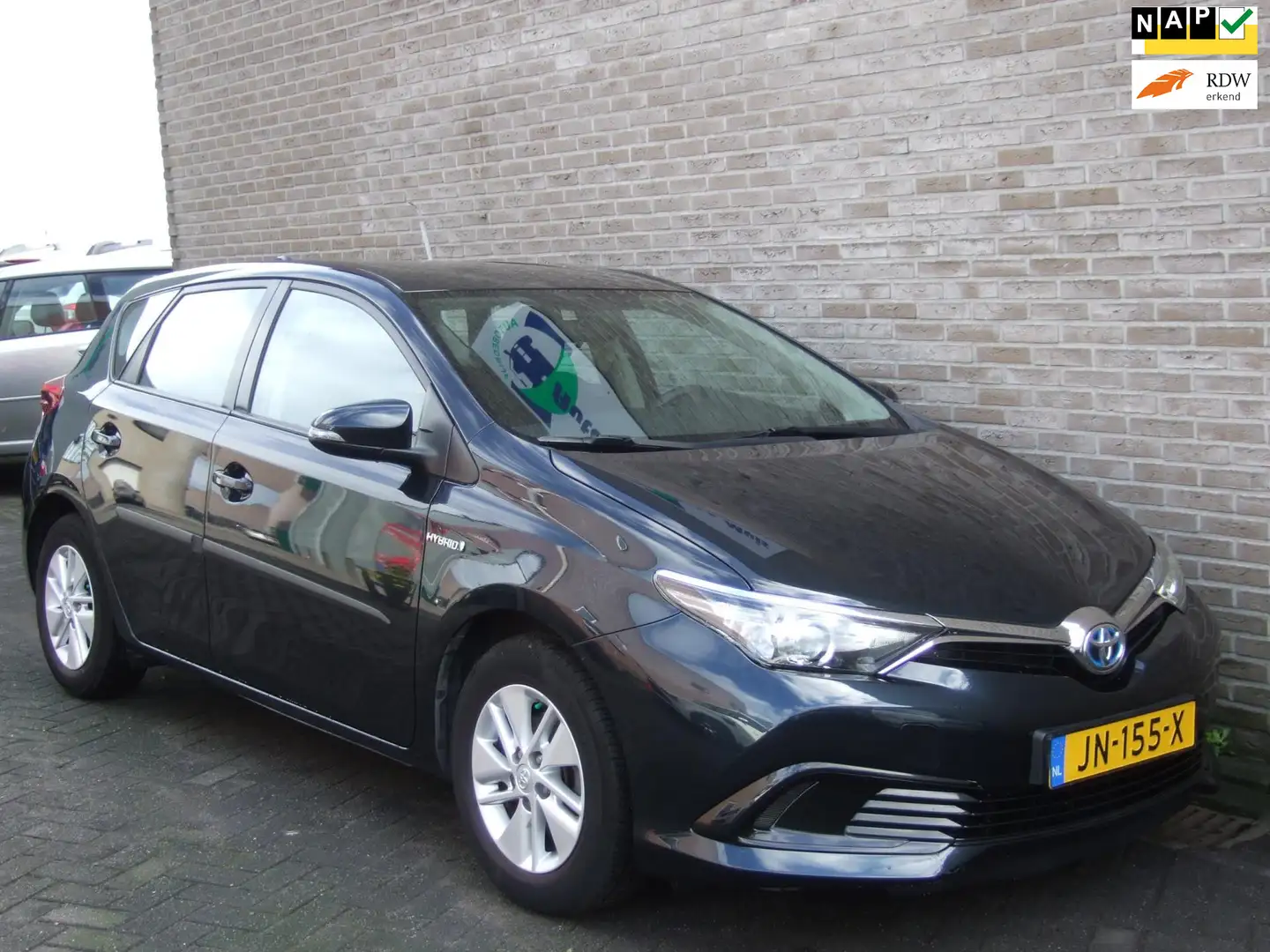 Toyota Auris 1.8 Hybrid Now - Trekhaak afn. - Dealer ond. - Gris - 1