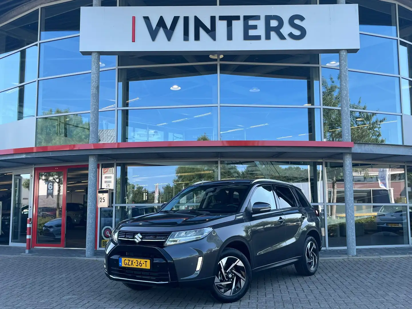 Suzuki Vitara 1.5 Hybrid Style | Navigatie | Camera | Trekhaak | Grijs - 1