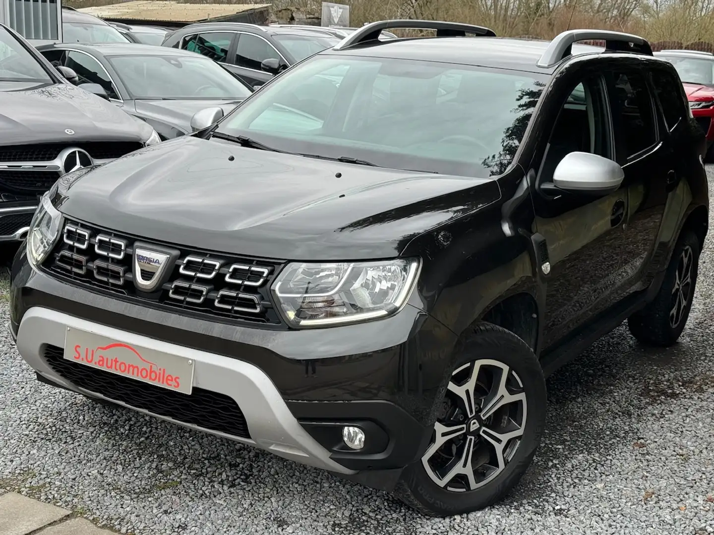 Dacia Duster 1.0i Prestige Essence LPG /FULL OPTIONS/Gar 12 M Zwart - 1