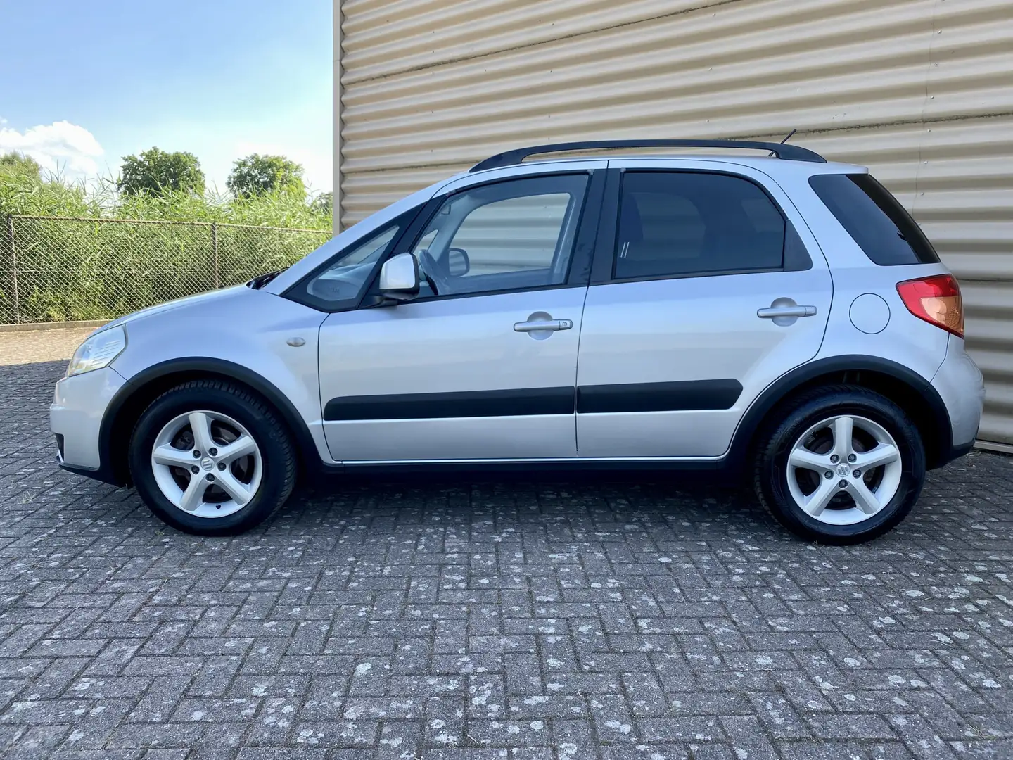 Suzuki SX4 1.6 Shogun [ 1e eig,airco,audio,lmv ] Grijs - 2