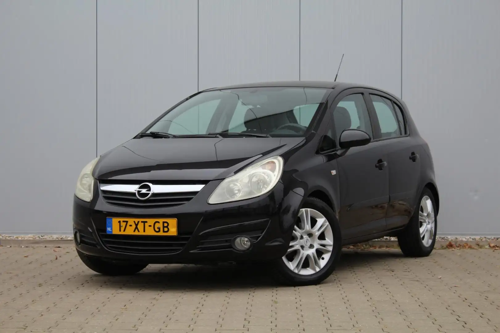 Opel Corsa 1.4-16V Cosmo | 5 Deurs | Airco | Cruise control | Zwart - 1