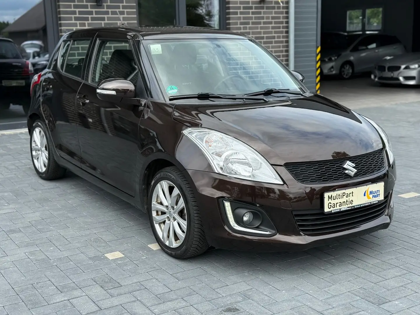 Suzuki Swift Club 1.3*Klima*Servo*AHK*1Hand*Elek-F+S* Braun - 1