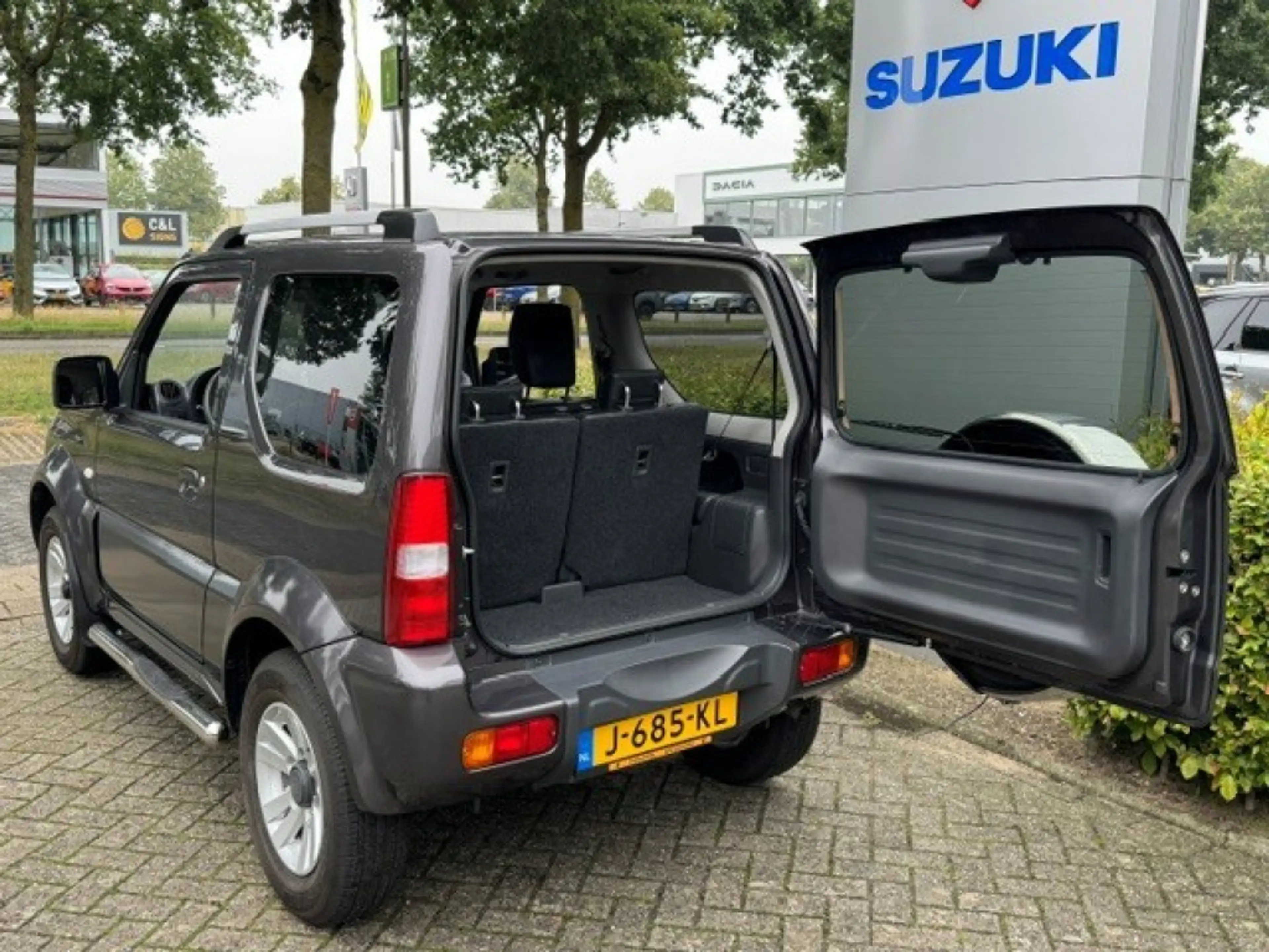Suzuki Jimny 1.3 Exclusive Metal Top 4x4 Airco/Leder/Trekhaak — photo 15