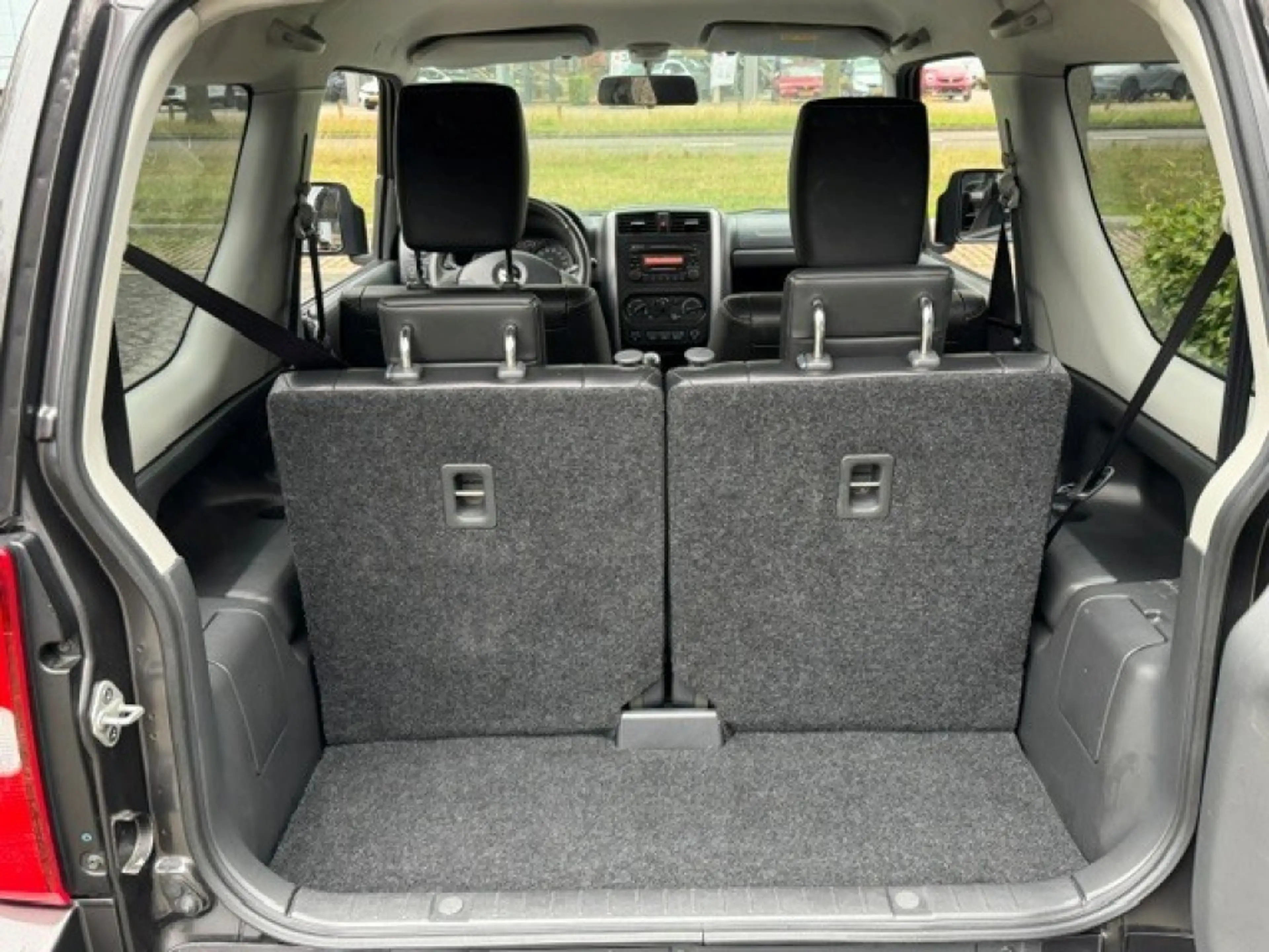 Suzuki Jimny 1.3 Exclusive Metal Top 4x4 Airco/Leder/Trekhaak — photo 13