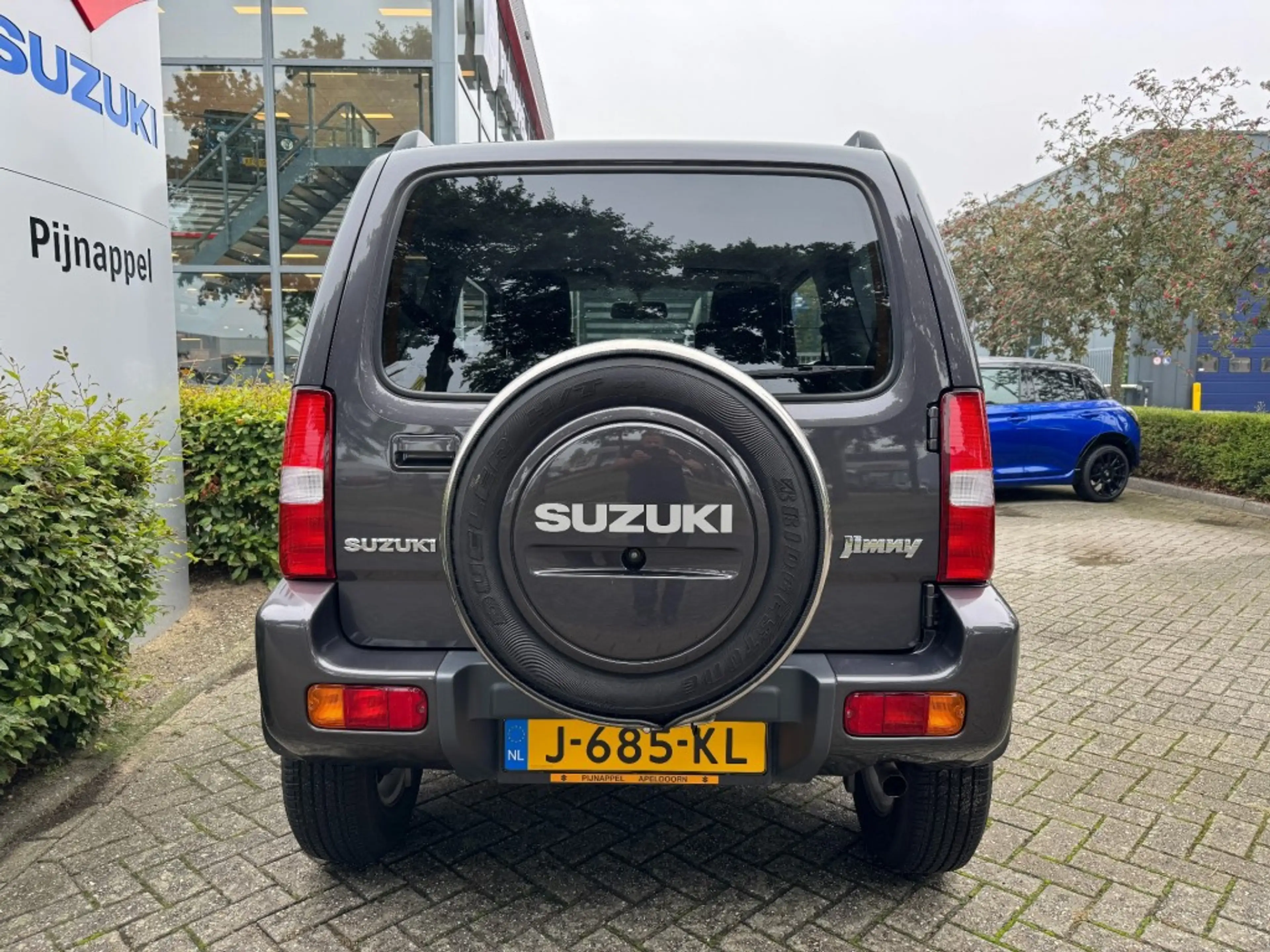 Suzuki Jimny 1.3 Exclusive Metal Top 4x4 Airco/Leder/Trekhaak — photo 7