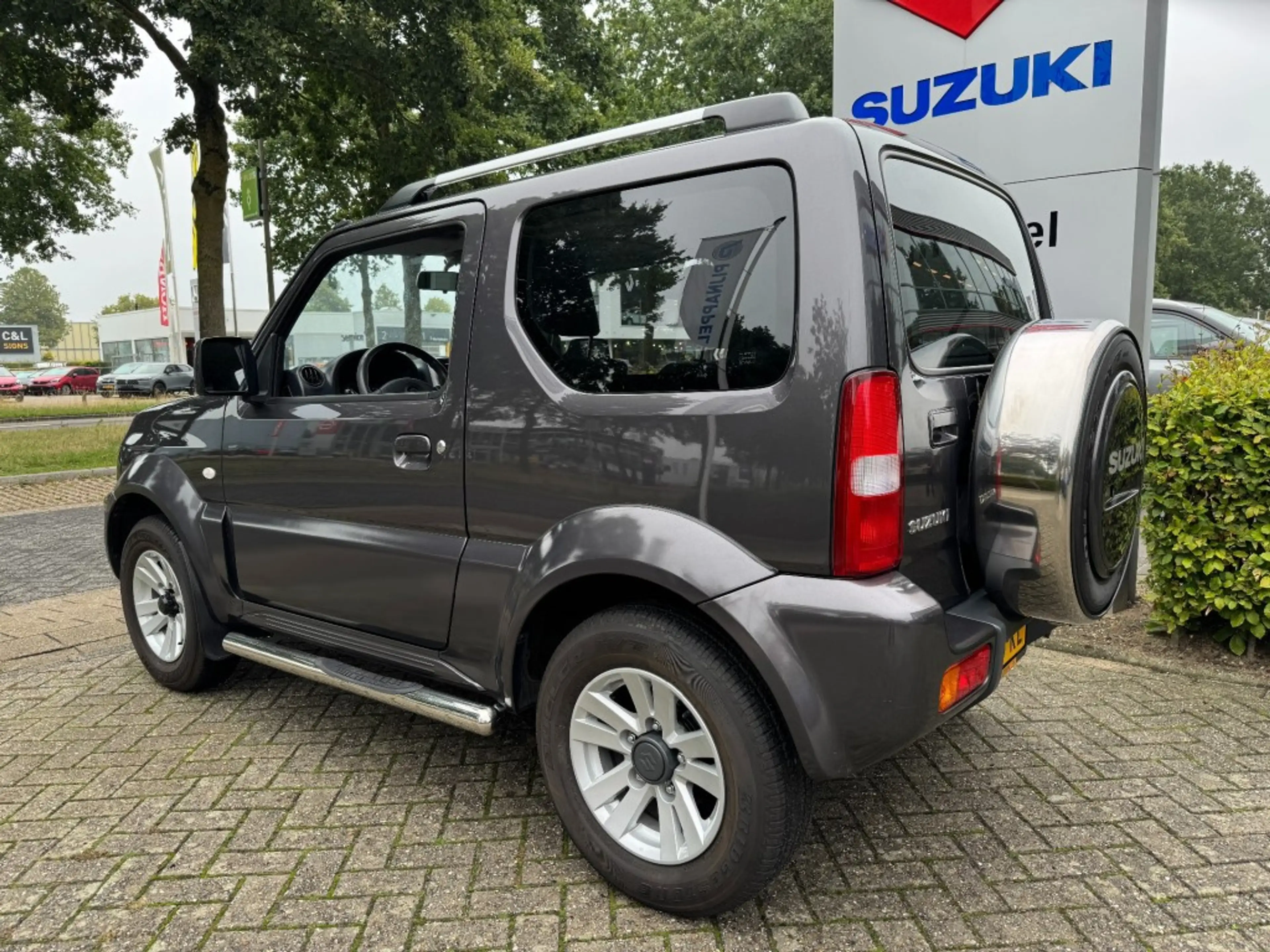 Suzuki Jimny 1.3 Exclusive Metal Top 4x4 Airco/Leder/Trekhaak — photo 2