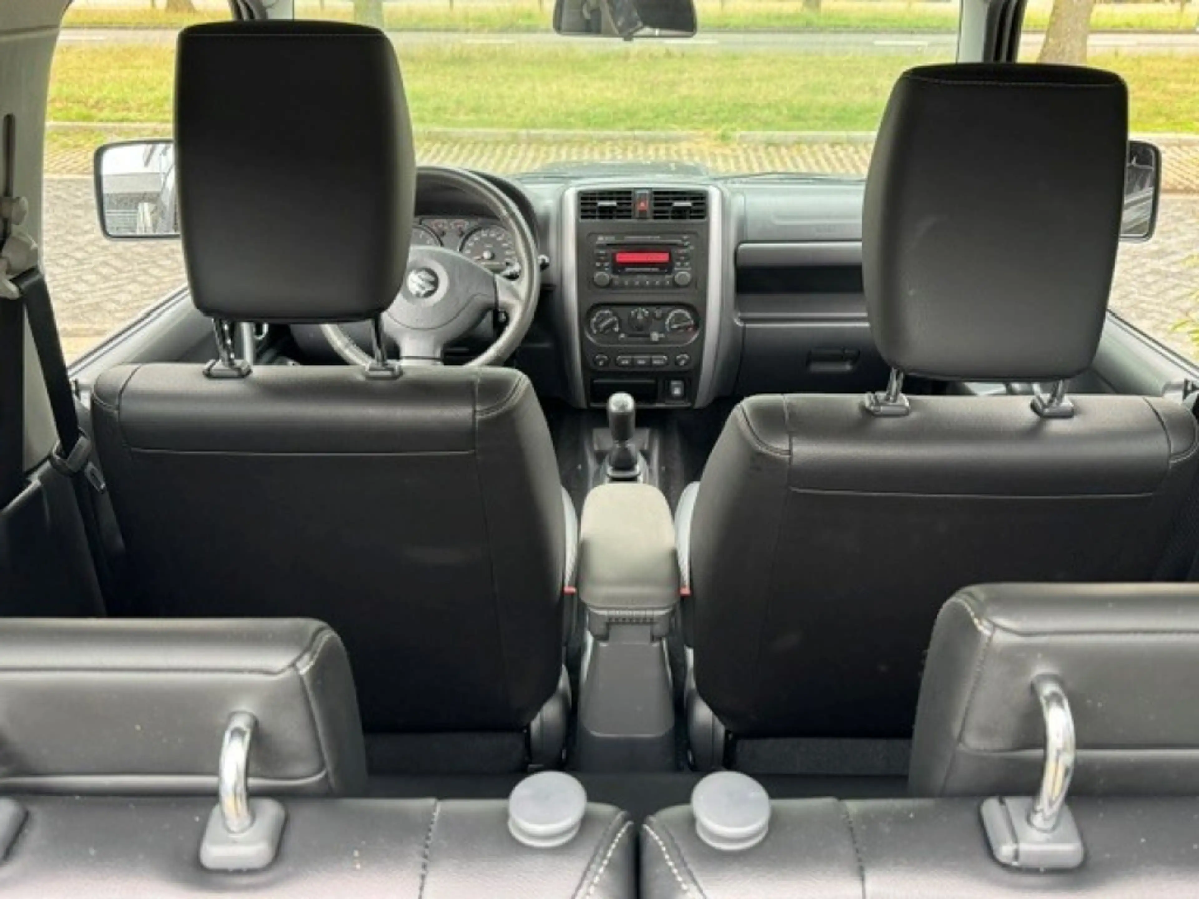 Suzuki Jimny 1.3 Exclusive Metal Top 4x4 Airco/Leder/Trekhaak — photo 14