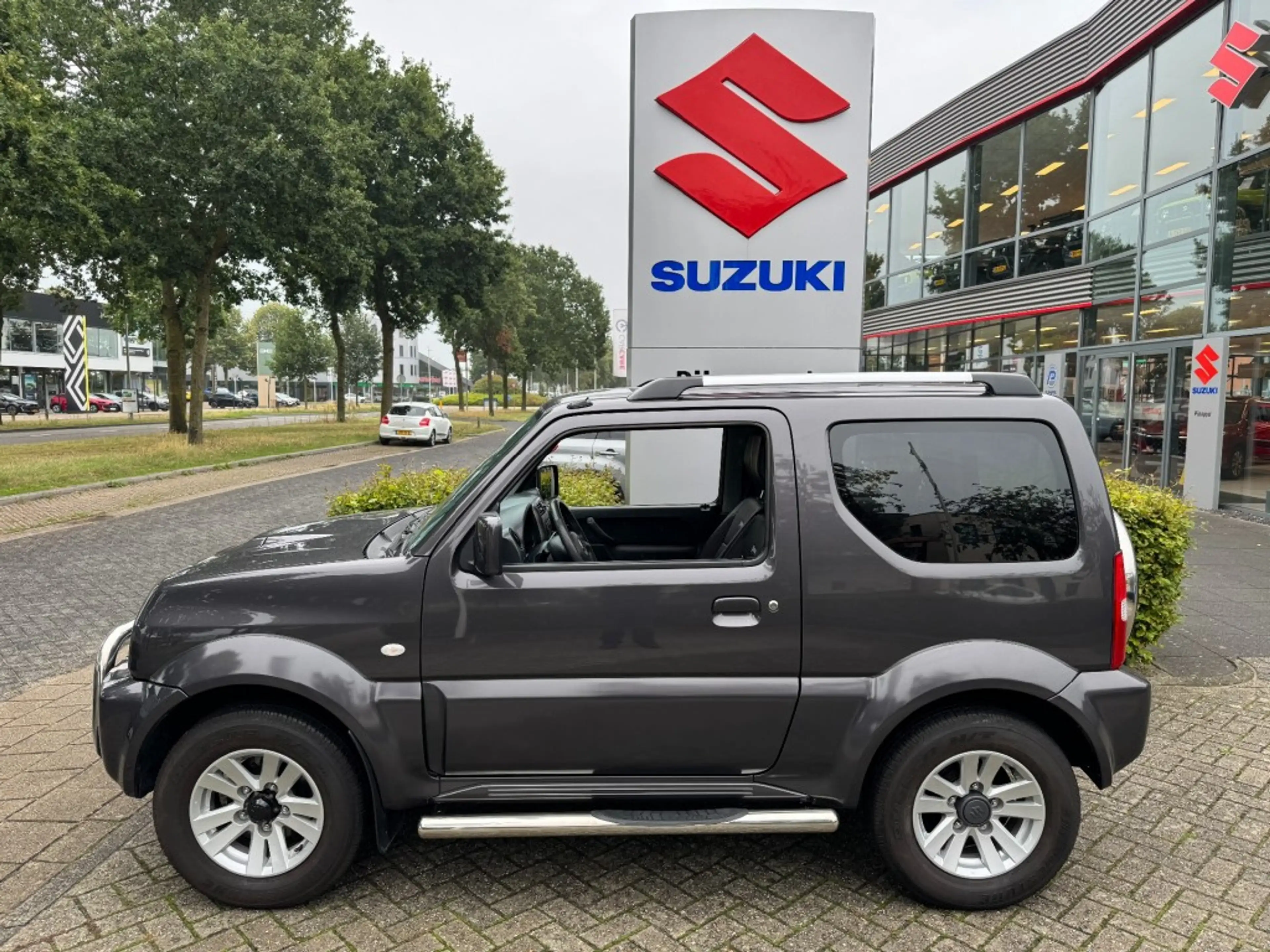 Suzuki Jimny 1.3 Exclusive Metal Top 4x4 Airco/Leder/Trekhaak — photo 6