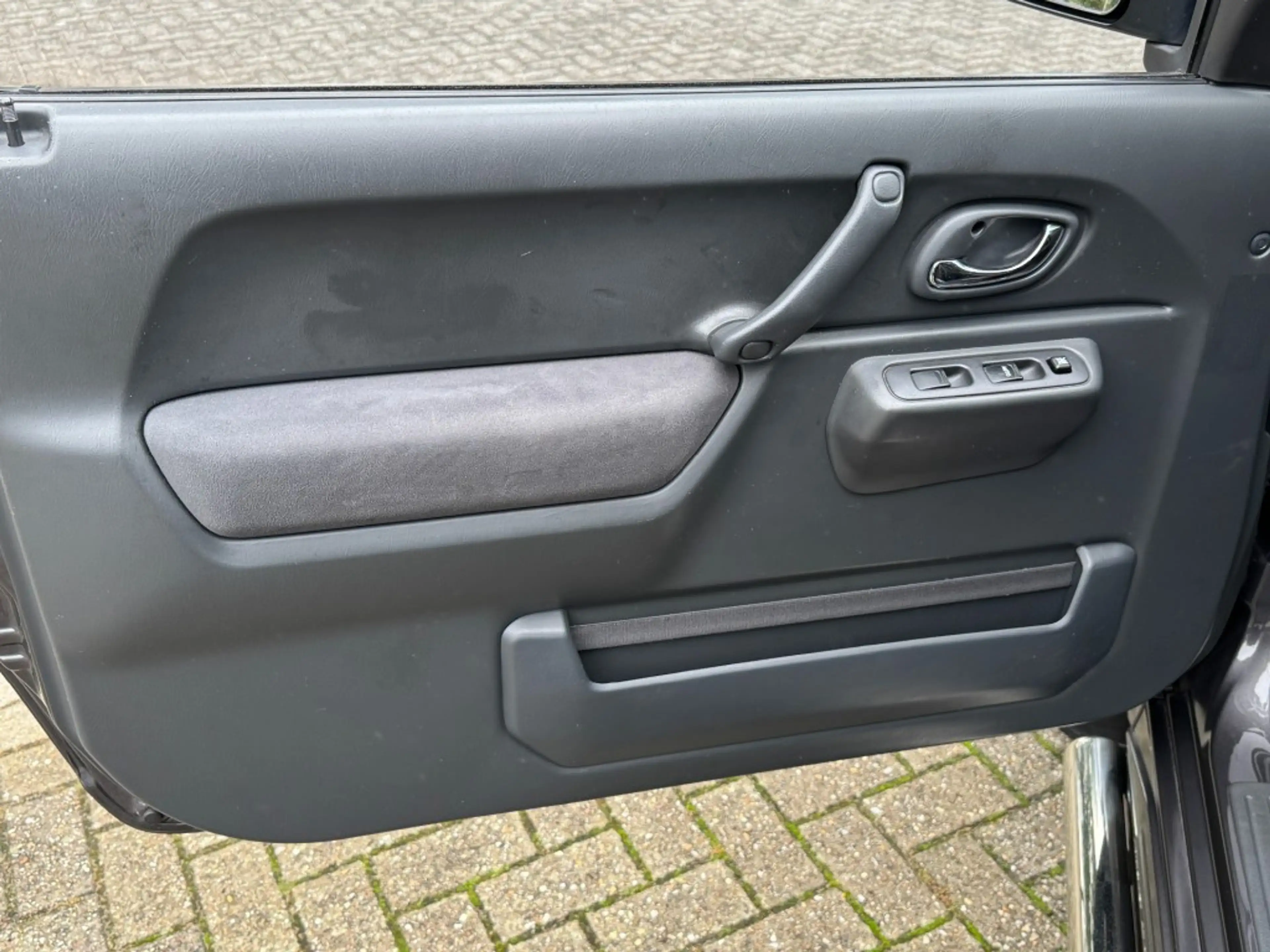 Suzuki Jimny 1.3 Exclusive Metal Top 4x4 Airco/Leder/Trekhaak — photo 17