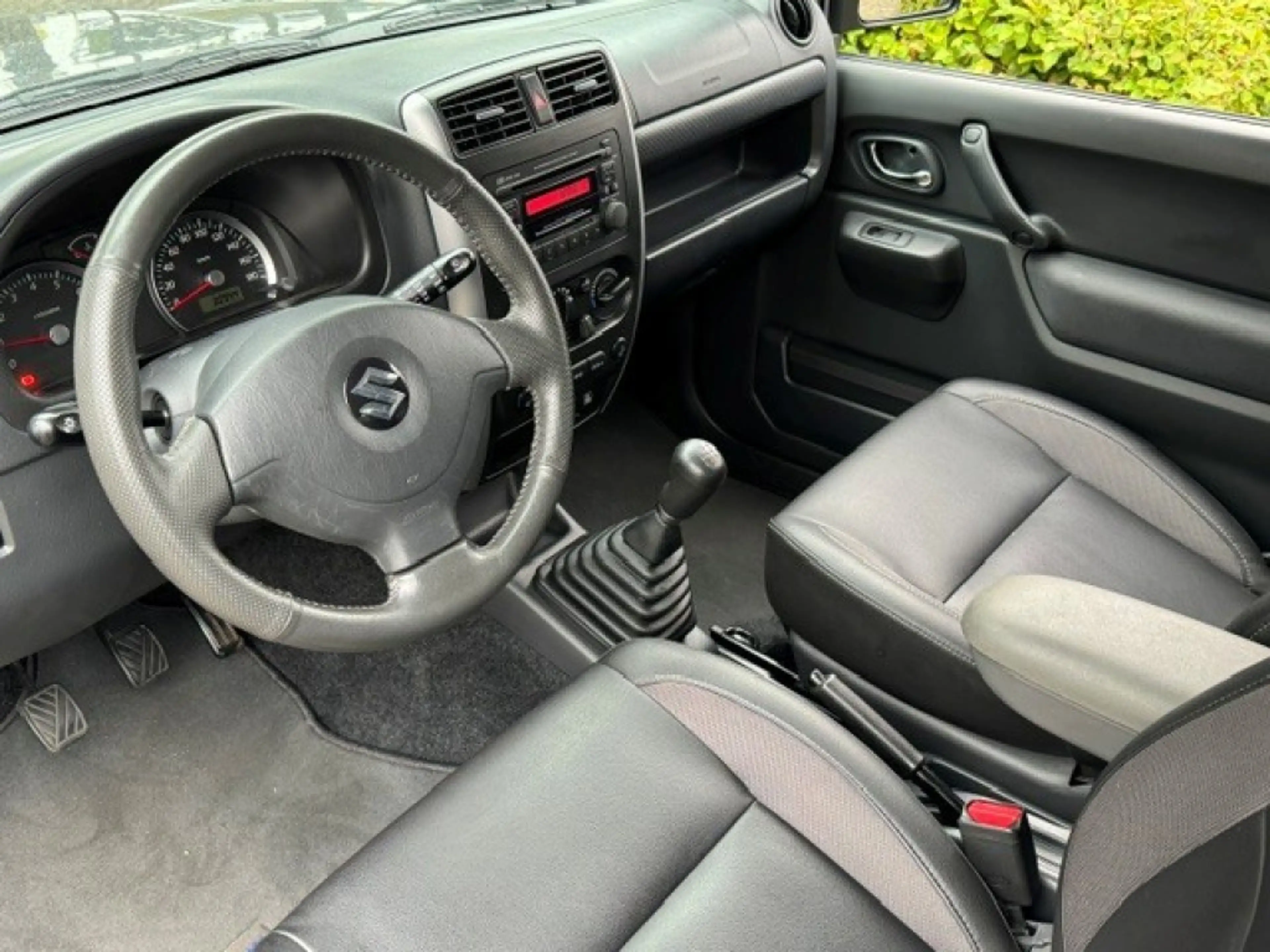 Suzuki Jimny 1.3 Exclusive Metal Top 4x4 Airco/Leder/Trekhaak — photo 18