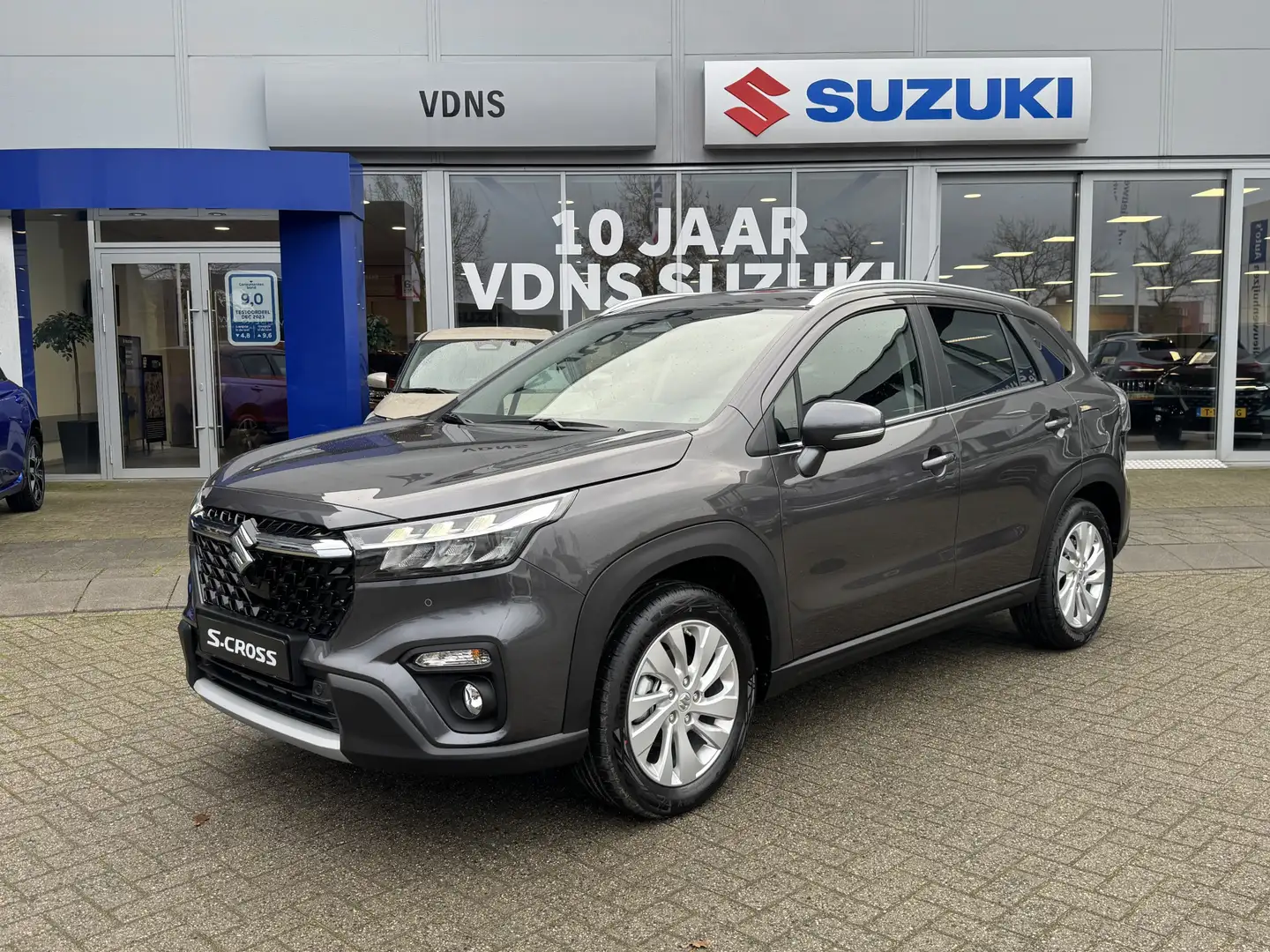 Suzuki S-Cross 1.4 Boosterjet Select Smart Hybrid Direct leverbaa Grijs - 1