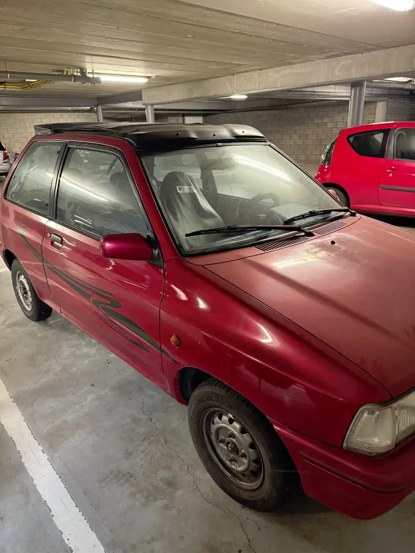 Mazda 121 (DA) 1.3-Cab - 1988 Rouge - 1