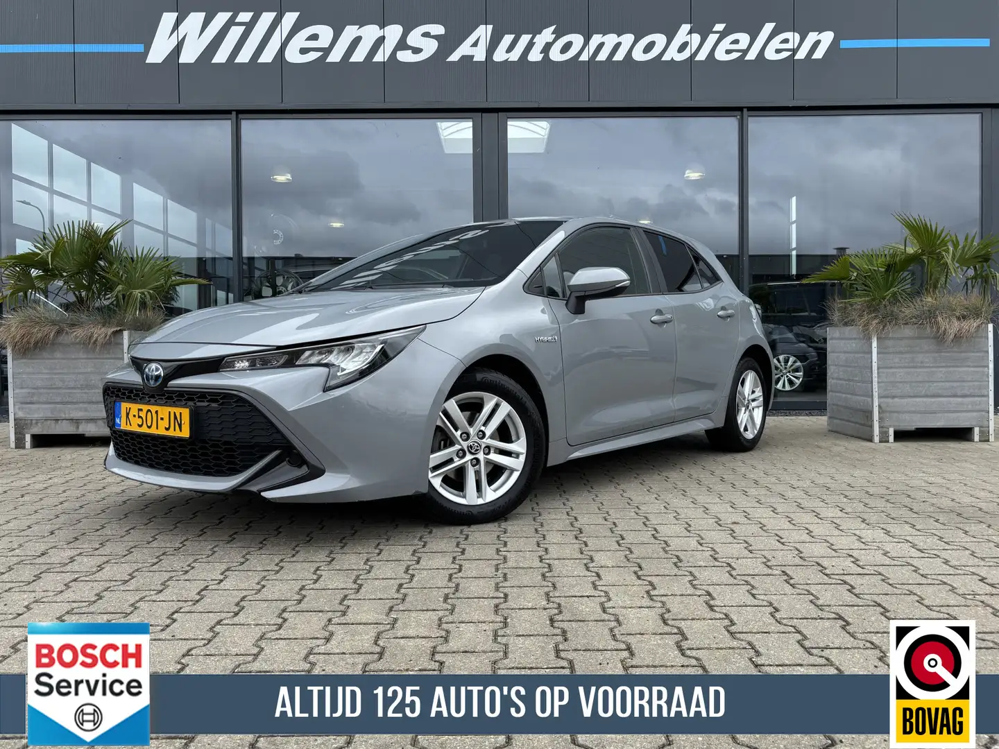 Toyota Corolla 1.8 Hybrid Active Navigatie, Camera & Climate Cont Grijs - 1