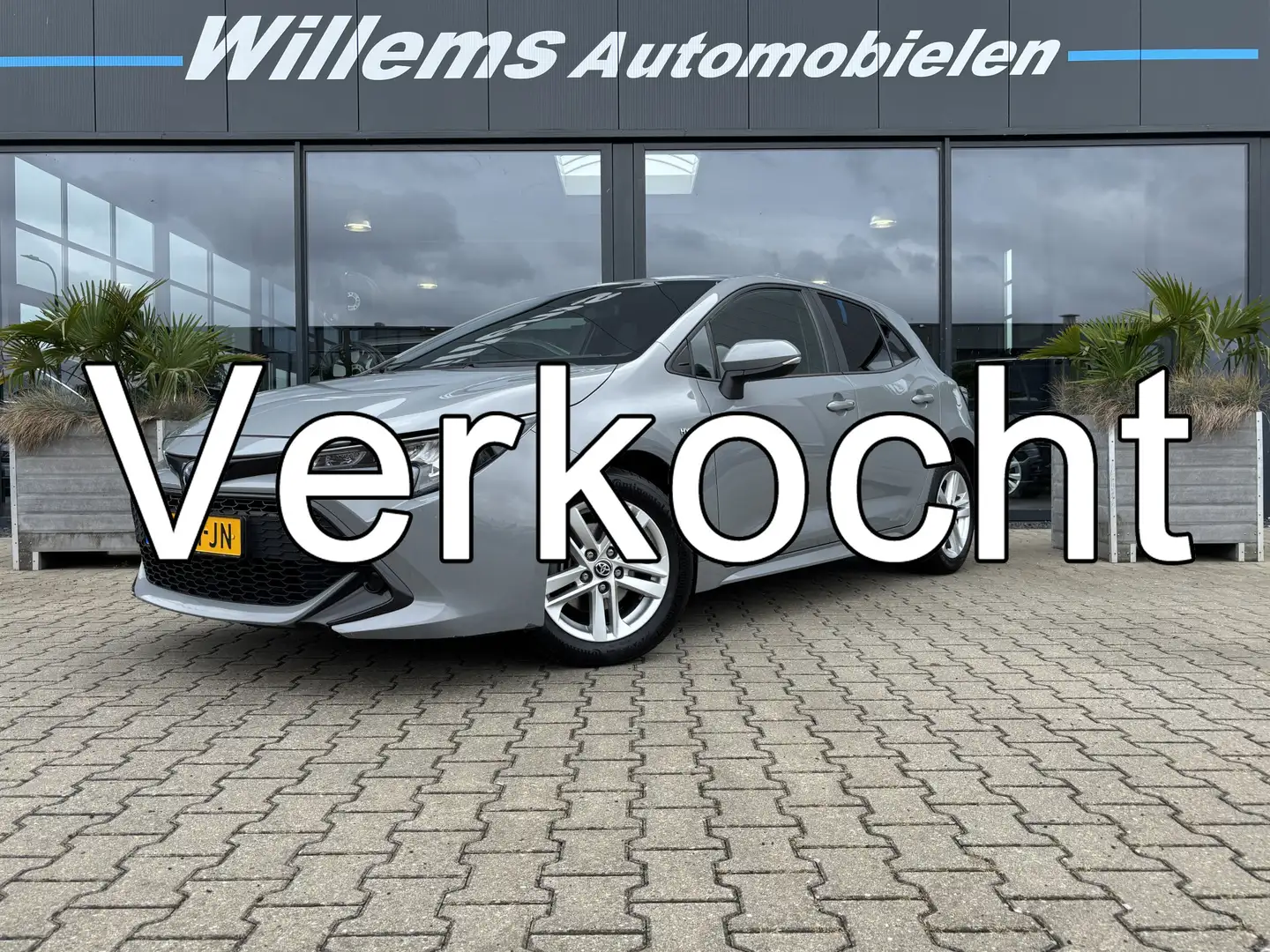 Toyota Corolla 1.8 Hybrid Active Navigatie, Camera & Climate Cont Gris - 1