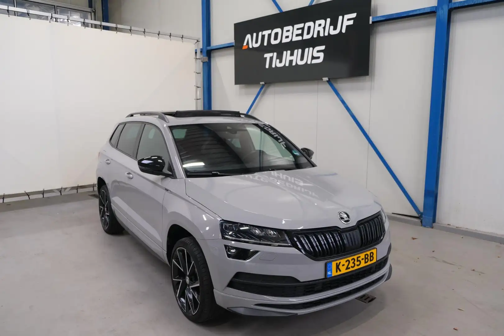 Skoda Karoq 1.5 TSI ACT Sportline Business - N.A.P. Airco, Cru Grijs - 1