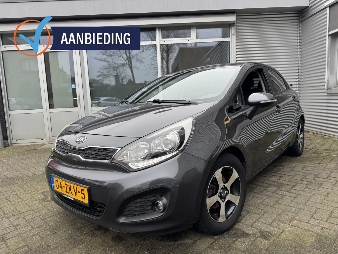Kia Rio 1.2 CVVT Design Ed. Inruilknaller! Grau - 1