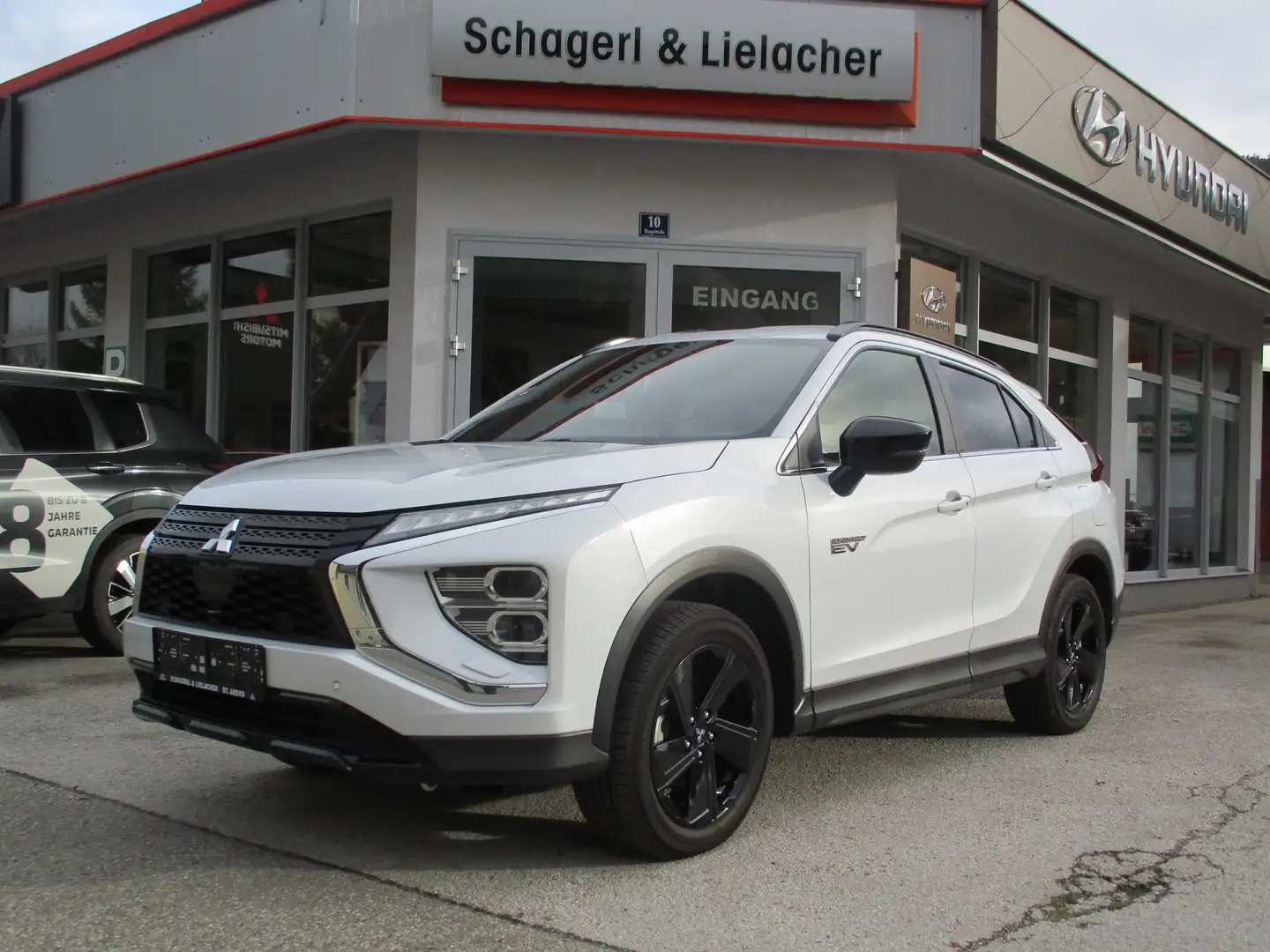 Mitsubishi Eclipse Cross PHEV 2,4 4WD Intense+ 45 Jahre Edition Weiß - 1