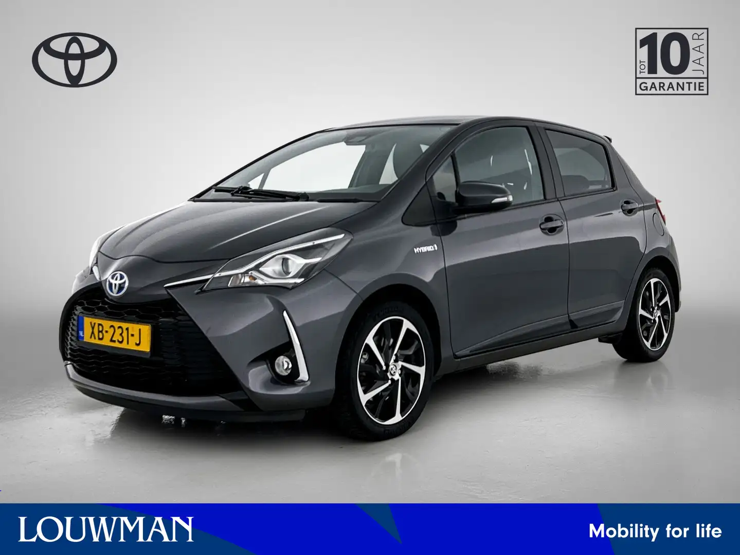 Toyota Yaris 1.5 Hybrid Executive | 1e Eigenaar | Panoramadak | Grijs - 1