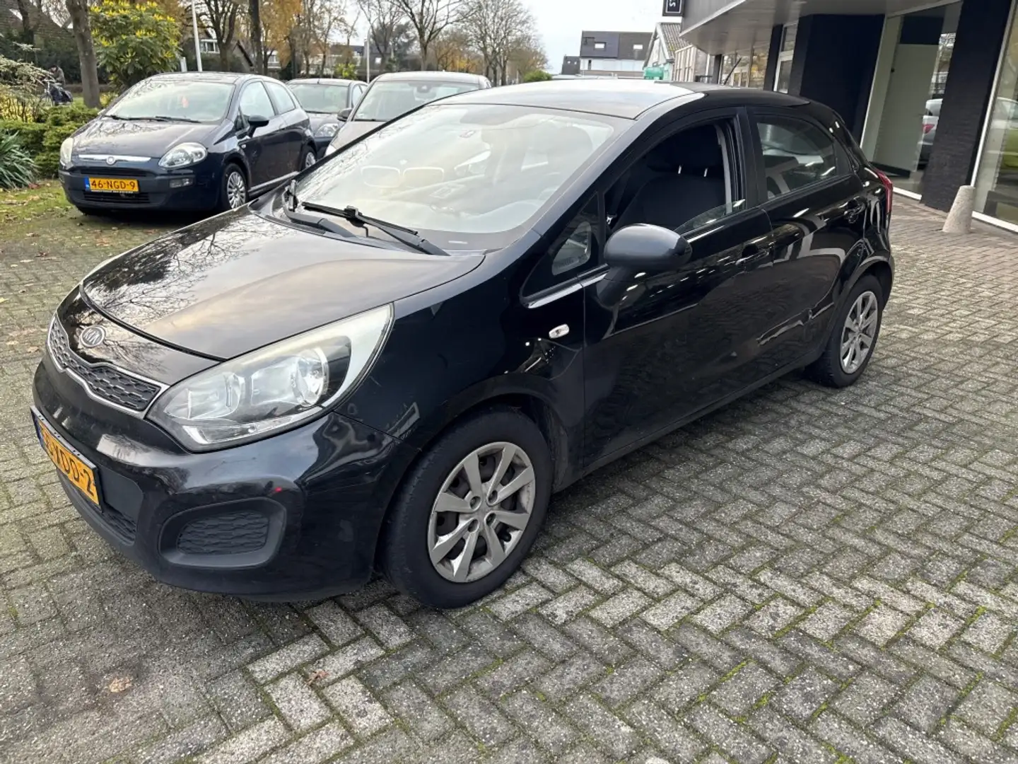 Kia Rio 1.1 CRDI COMF. PACK / AIRCO / CRUISE / EXPORT Zwart - 1