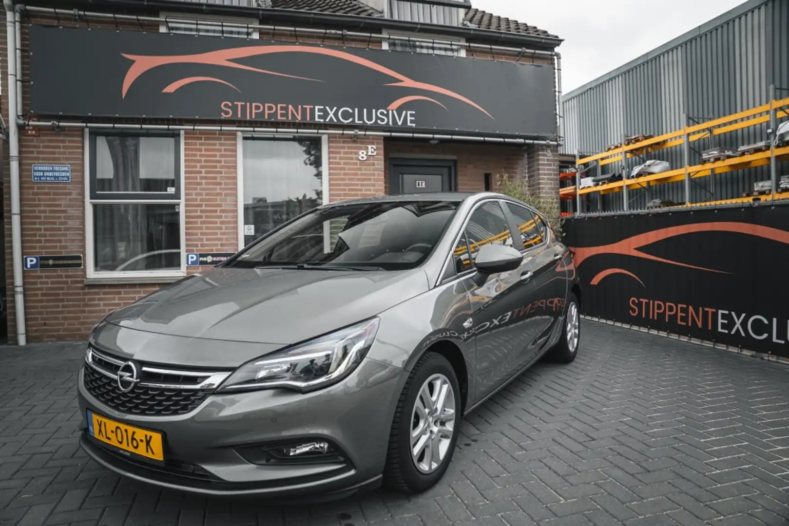 Opel Astra 1.0 T. ONLINE ED. Grijs - 1