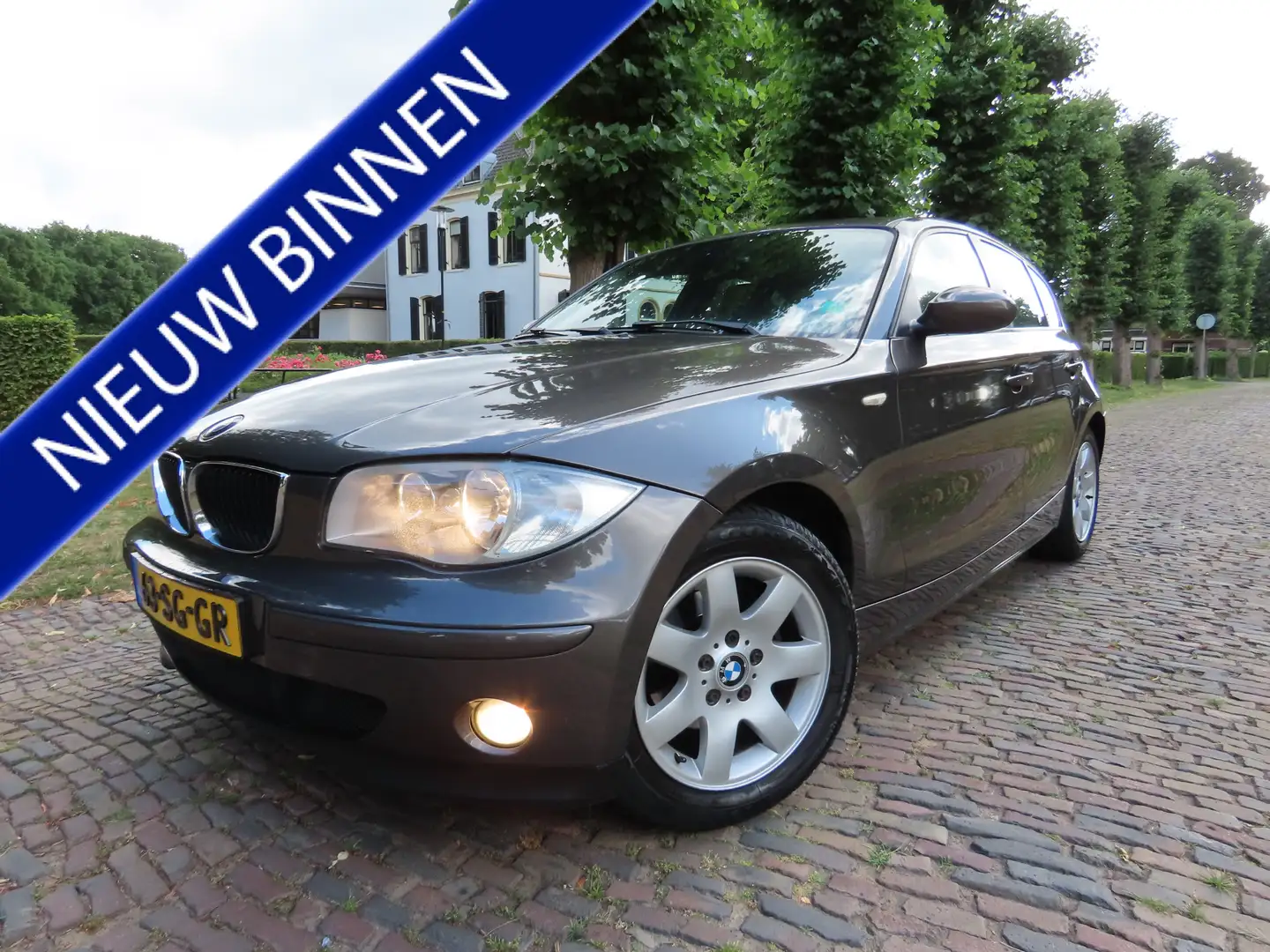 BMW 118 1-serie 118i High Executive Automaat Leer Airco Cr Bruin - 1