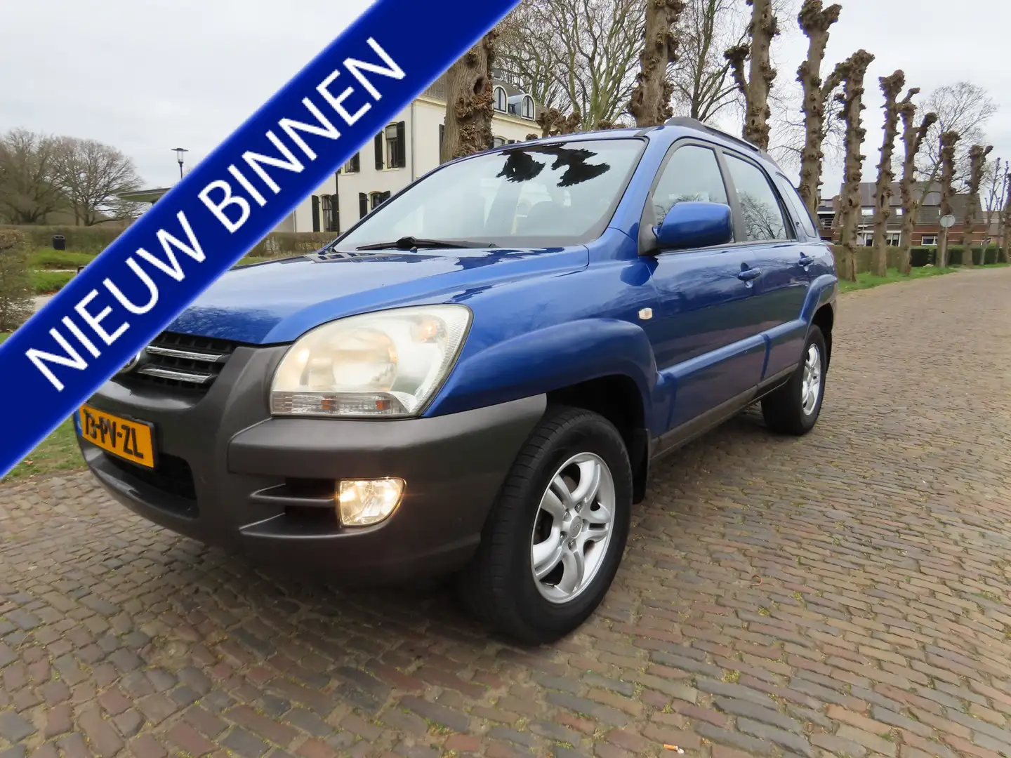 Kia Sportage 2.0 CVVT Comfort Airco Cruisecontrol Lm Velgen Tre Blauw - 1
