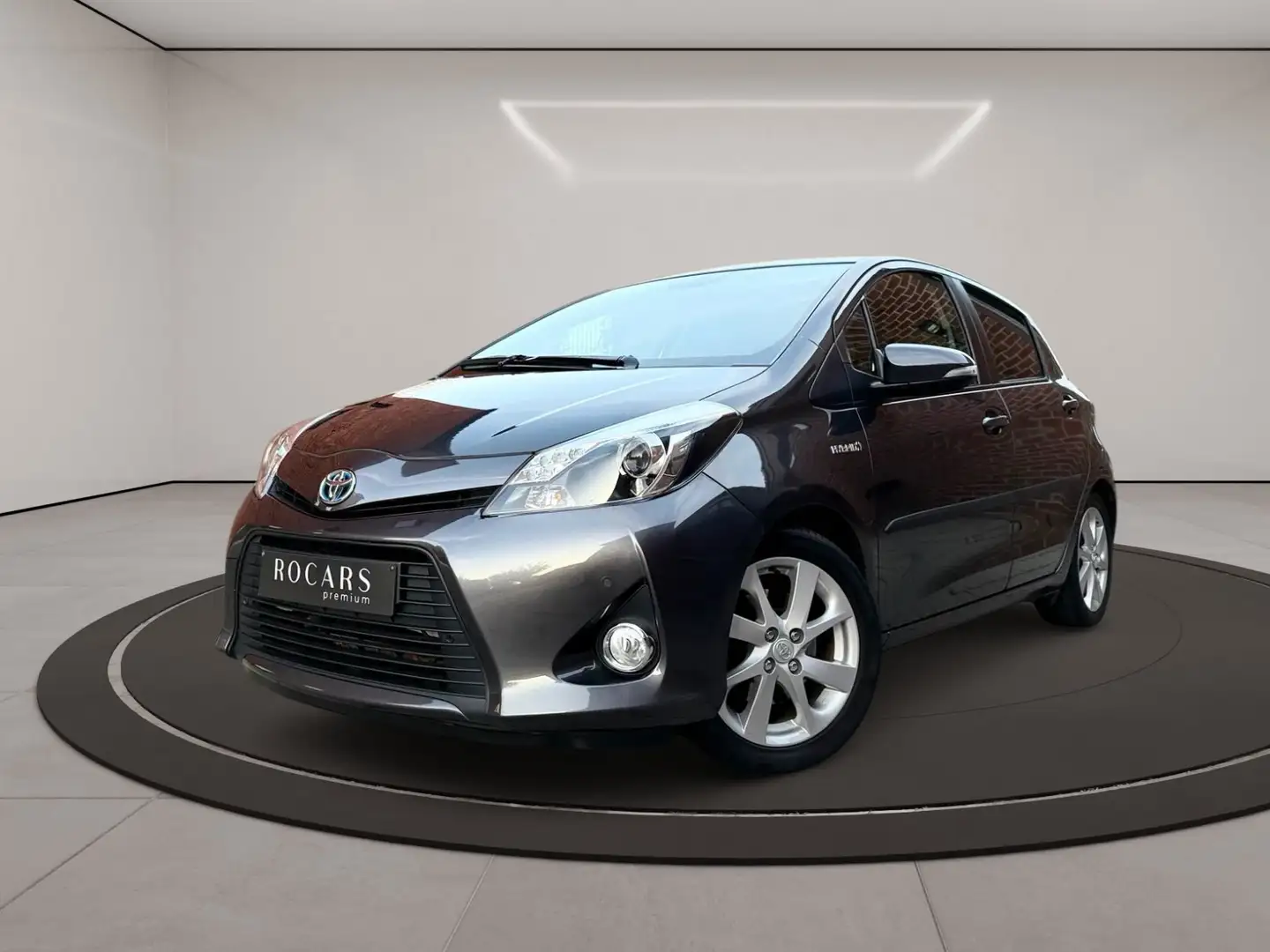 Toyota Yaris 1.5i *HYBRID*GPS*CAMERA*CRUISE*GARANTIE 12MOIS Gris - 1