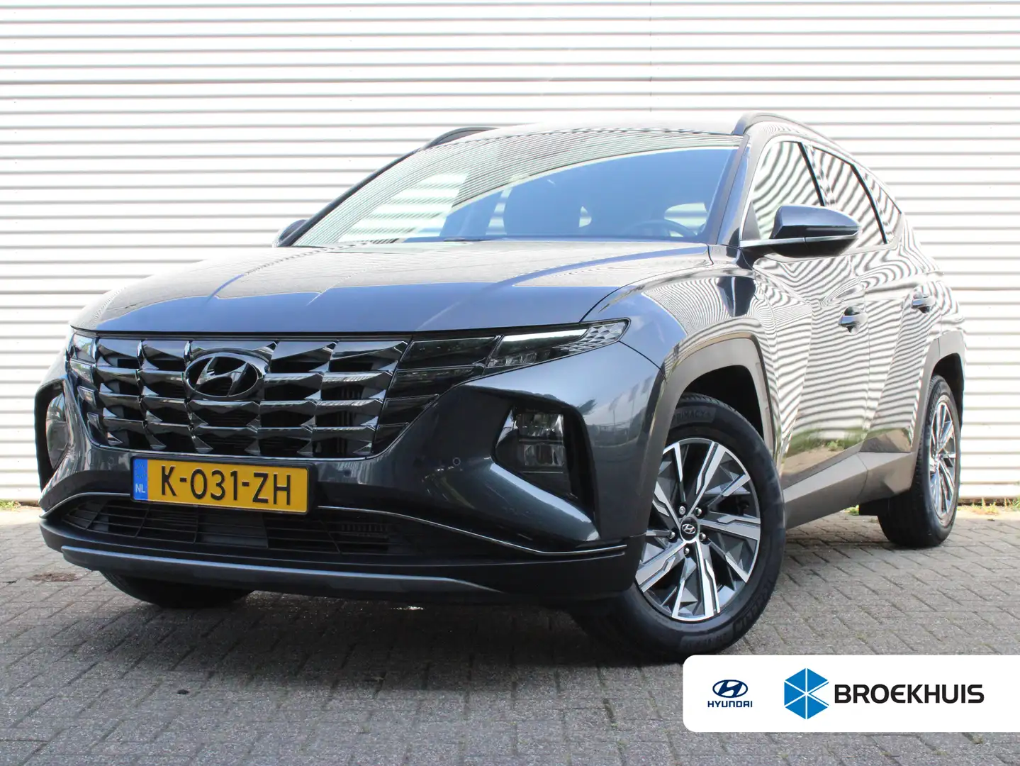 Hyundai TUCSON 1.6 T-GDI MHEV Comfort | Achteruitrijcamera | Airc Grijs - 1