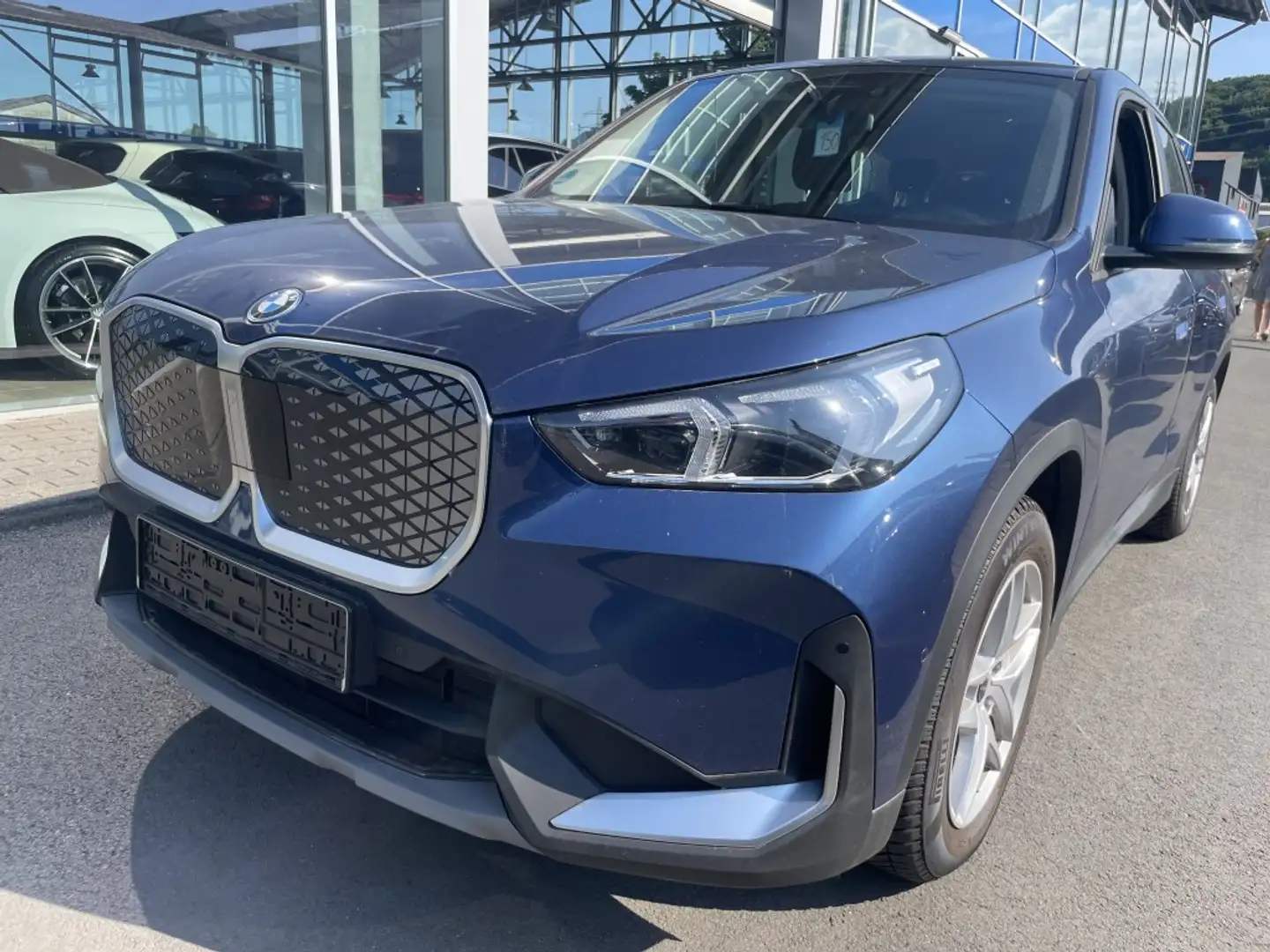 BMW X1 20 eDrive AHK LED Navi R.Cam SHZ PDC DAB ACC Blau - 1