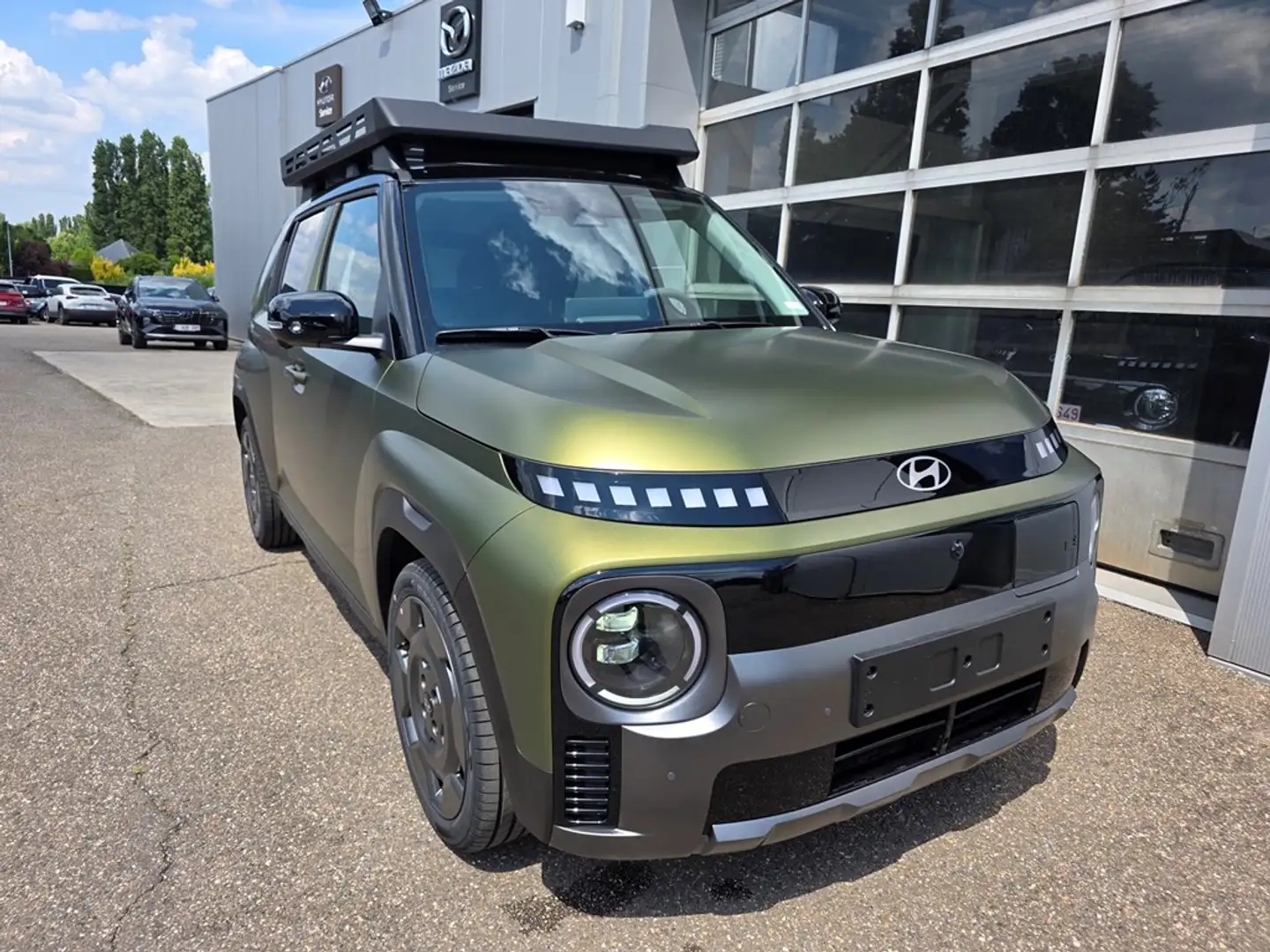 Hyundai Inster NIEUW - 49kWh - CROSS - ROOFRACK Зелений - 1