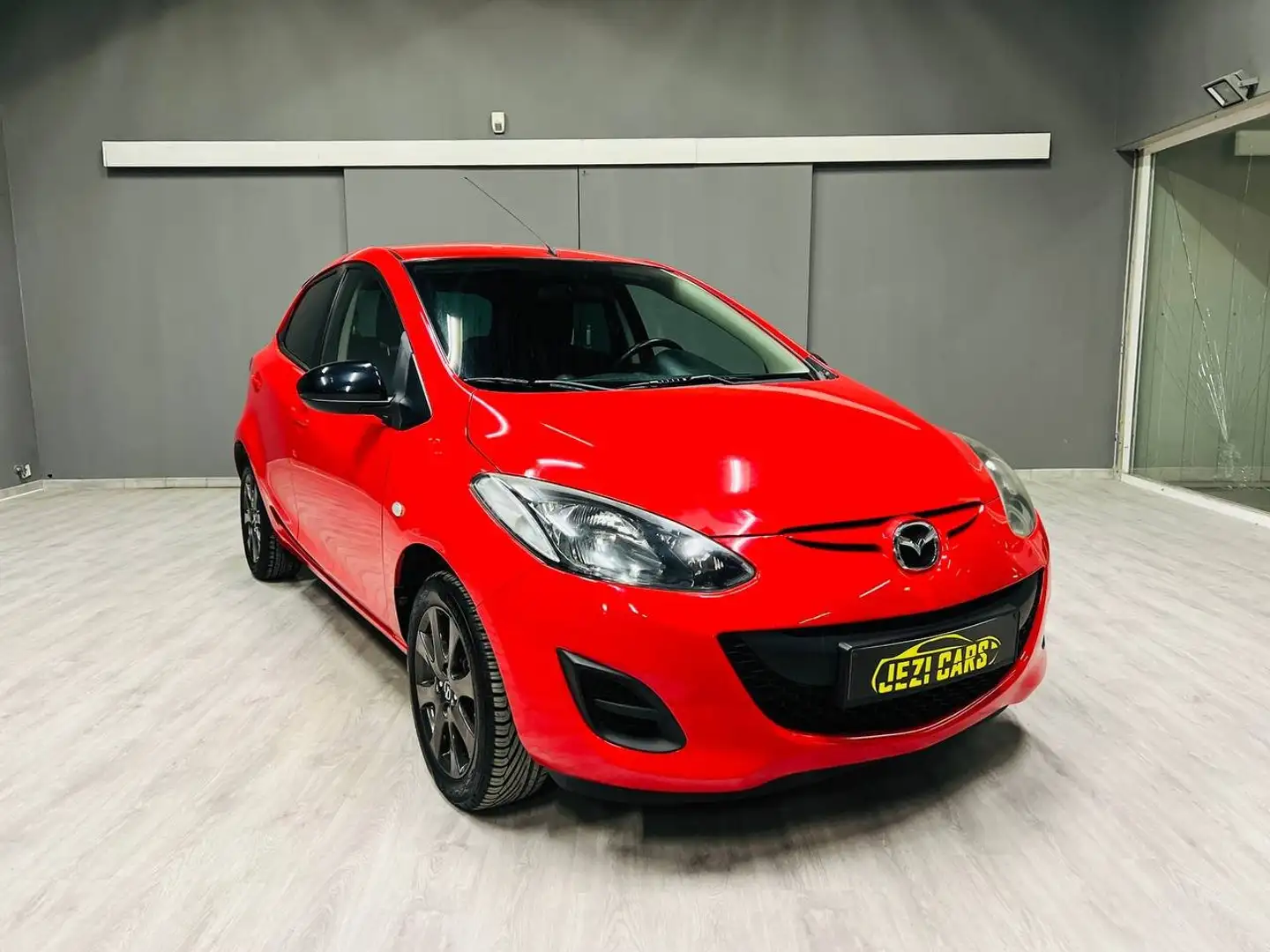 Mazda 2 1.3i|Airco|1JaarGarantie|Camera|ApleCarPlay|Blueth Rood - 1